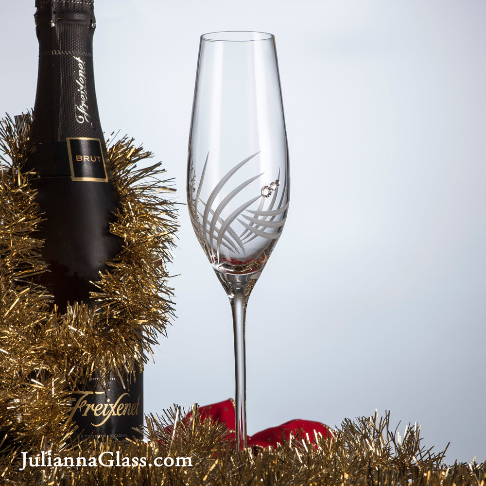 Set of 2 elegant Breeze Champagne Glasses with Swarovski crystals in a luxurious gift box, showcasing exquisite hand-cut designs.