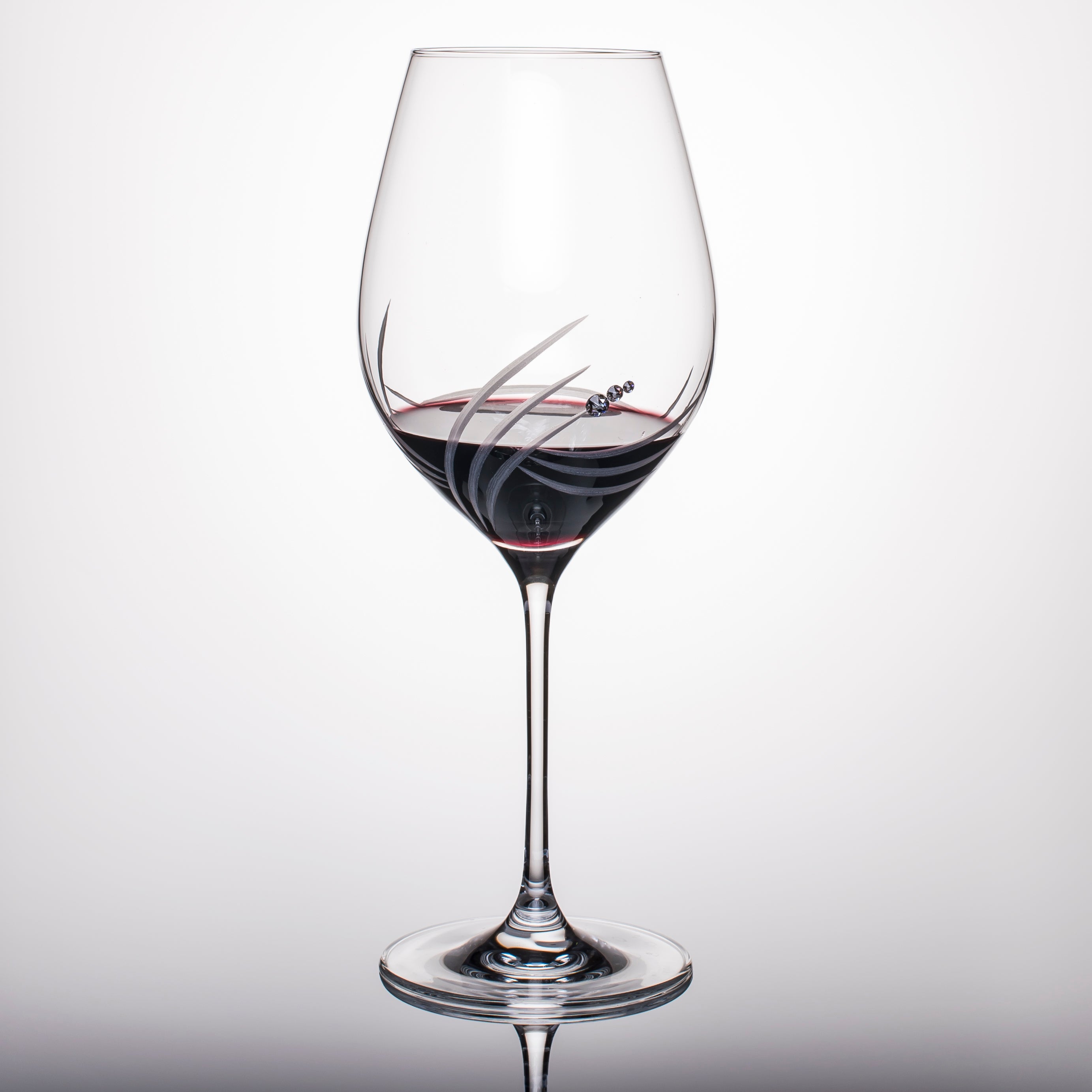 Set of two elegant Breeze Red Wine Glasses with Swarovski crystals in a gift box, showcasing handcrafted designs.