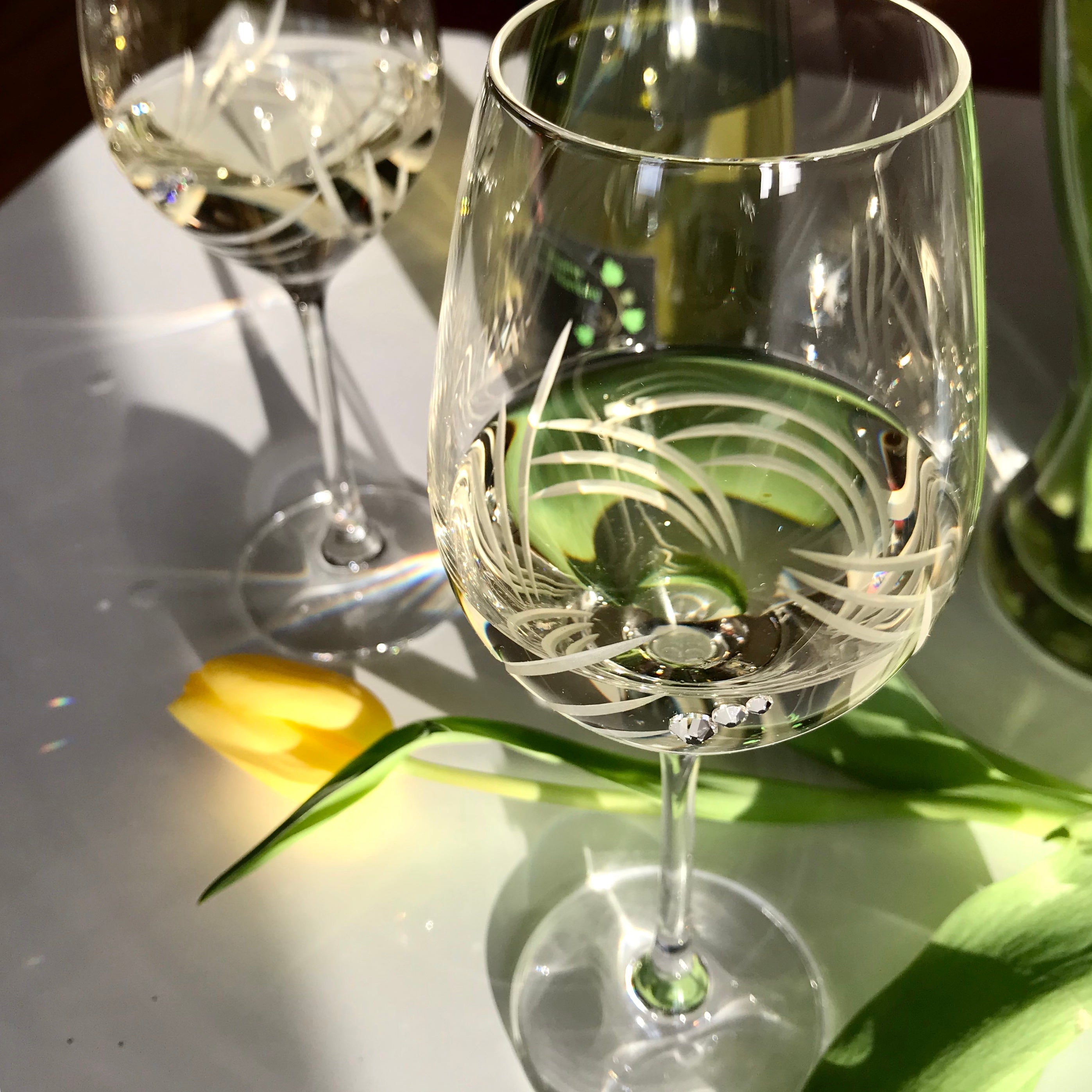 Set of 2 Breeze White Wine Glasses with Swarovski crystals in an elegant gift box, showcasing intricate hand-cut designs.