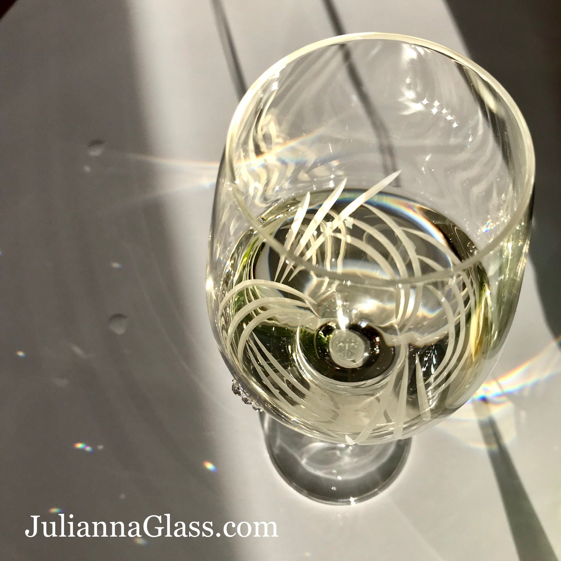 Set of 2 Breeze White Wine Glasses with Swarovski crystals in an elegant gift box, showcasing intricate hand-cut designs.