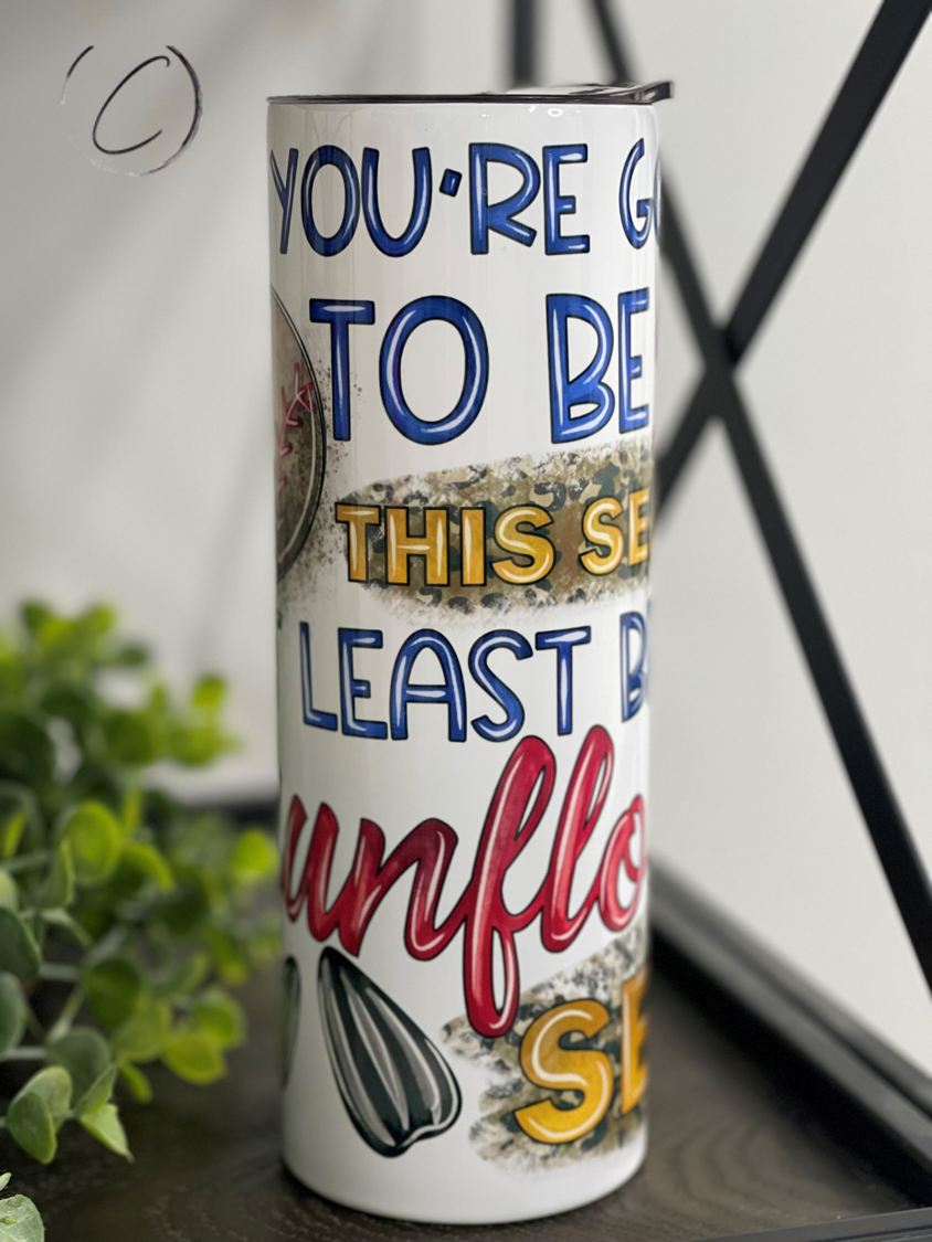 Bring The Sunflower Seeds 20oz Skinny Tumbler featuring a vibrant sunflower design, perfect for hot and cold beverages.