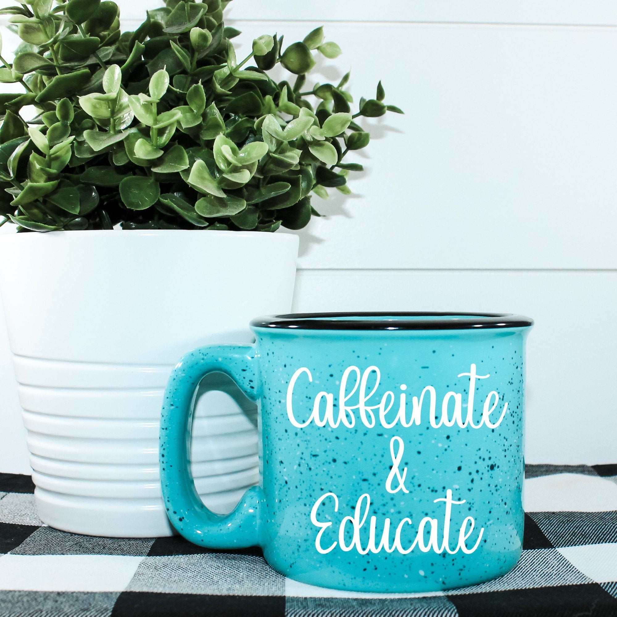 Caffeinate And Educate Campfire Mug with vibrant design, perfect for coffee lovers.