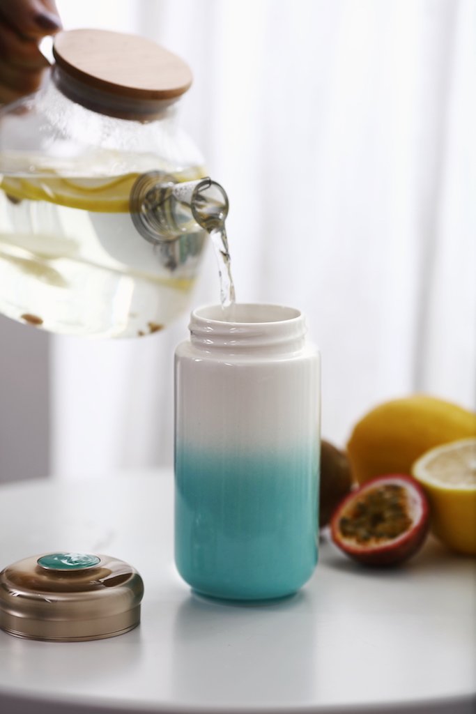 Cheer Up Tumbler with tourmaline ceramic lining and silicone cover, elegantly designed for hot and cold beverages.