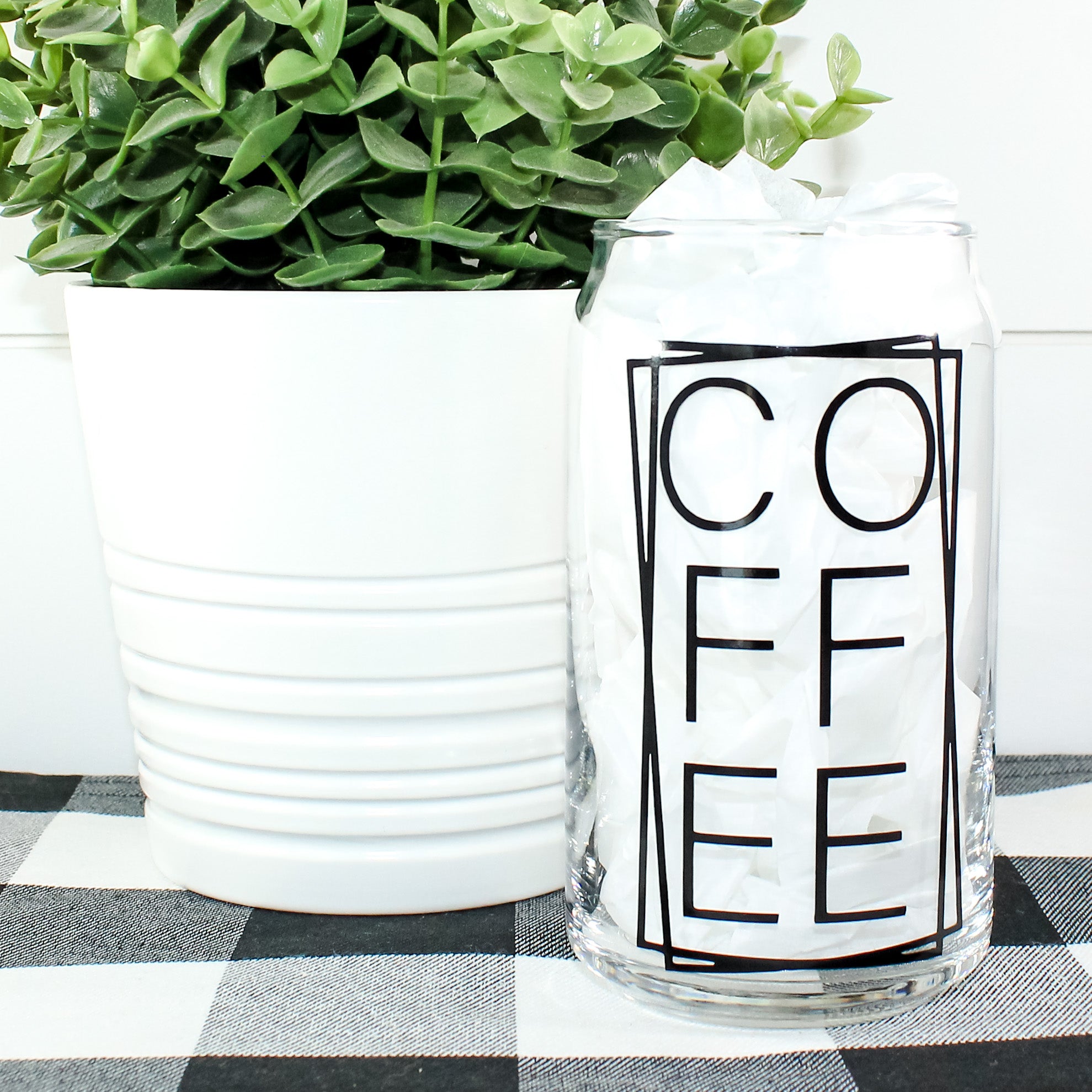 Stylish Coffee Can Glass with vibrant vinyl design, perfect for beverages.