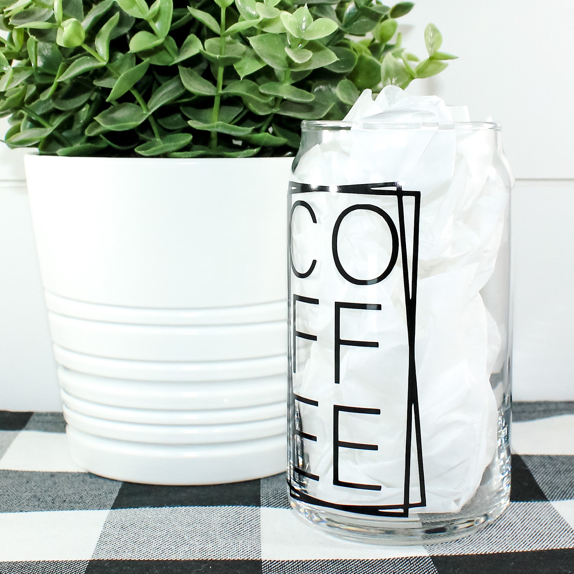 Stylish Coffee Can Glass with vibrant vinyl design, perfect for beverages.