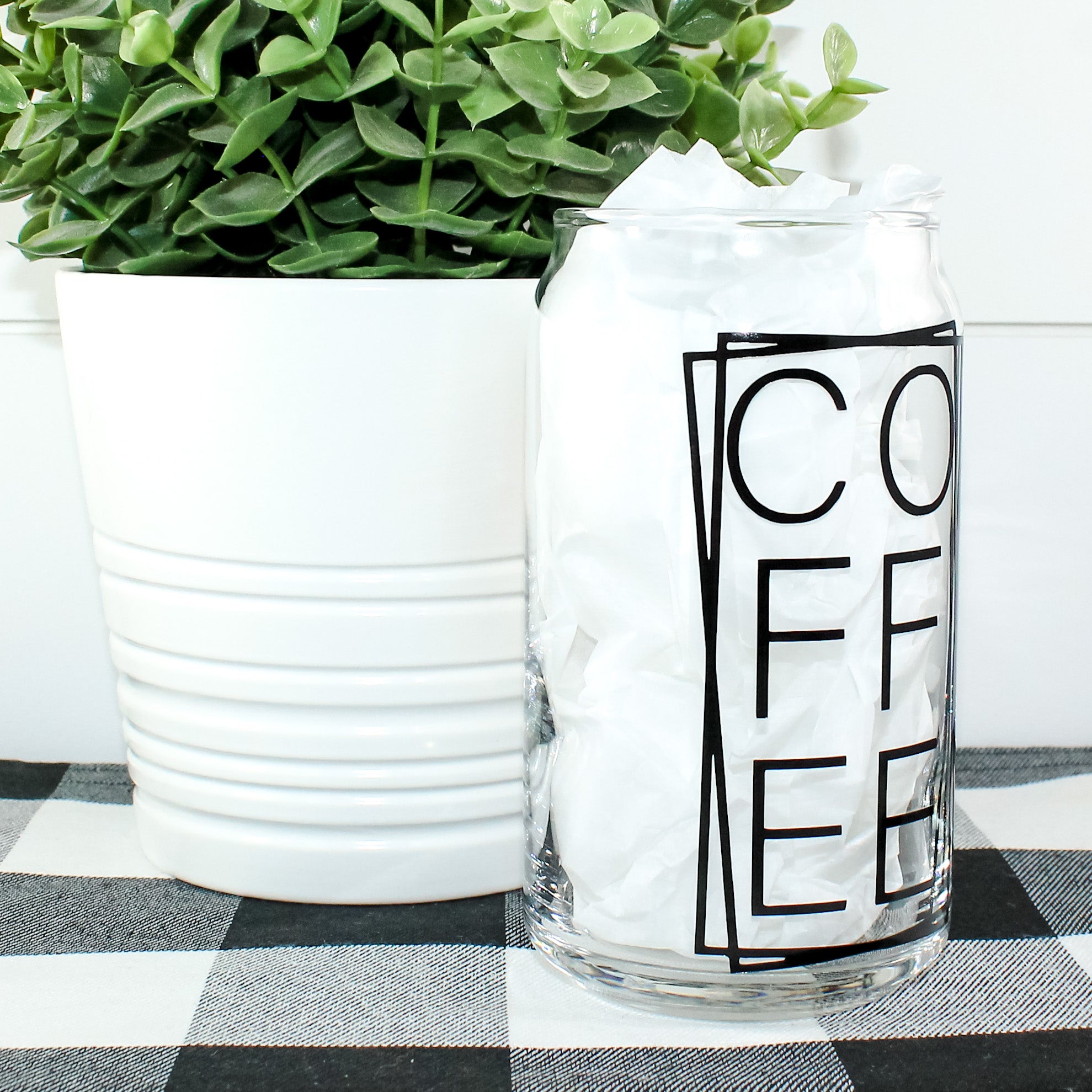 Stylish Coffee Can Glass with vibrant vinyl design, perfect for beverages.