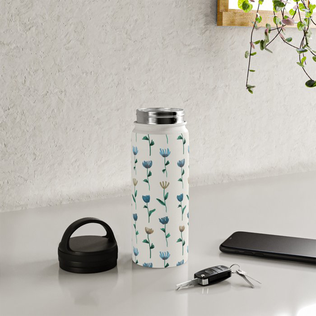 Colorful Flower Handle Lid Water Bottle with a matte finish and floral design, showcasing its stainless steel construction and ergonomic handle.