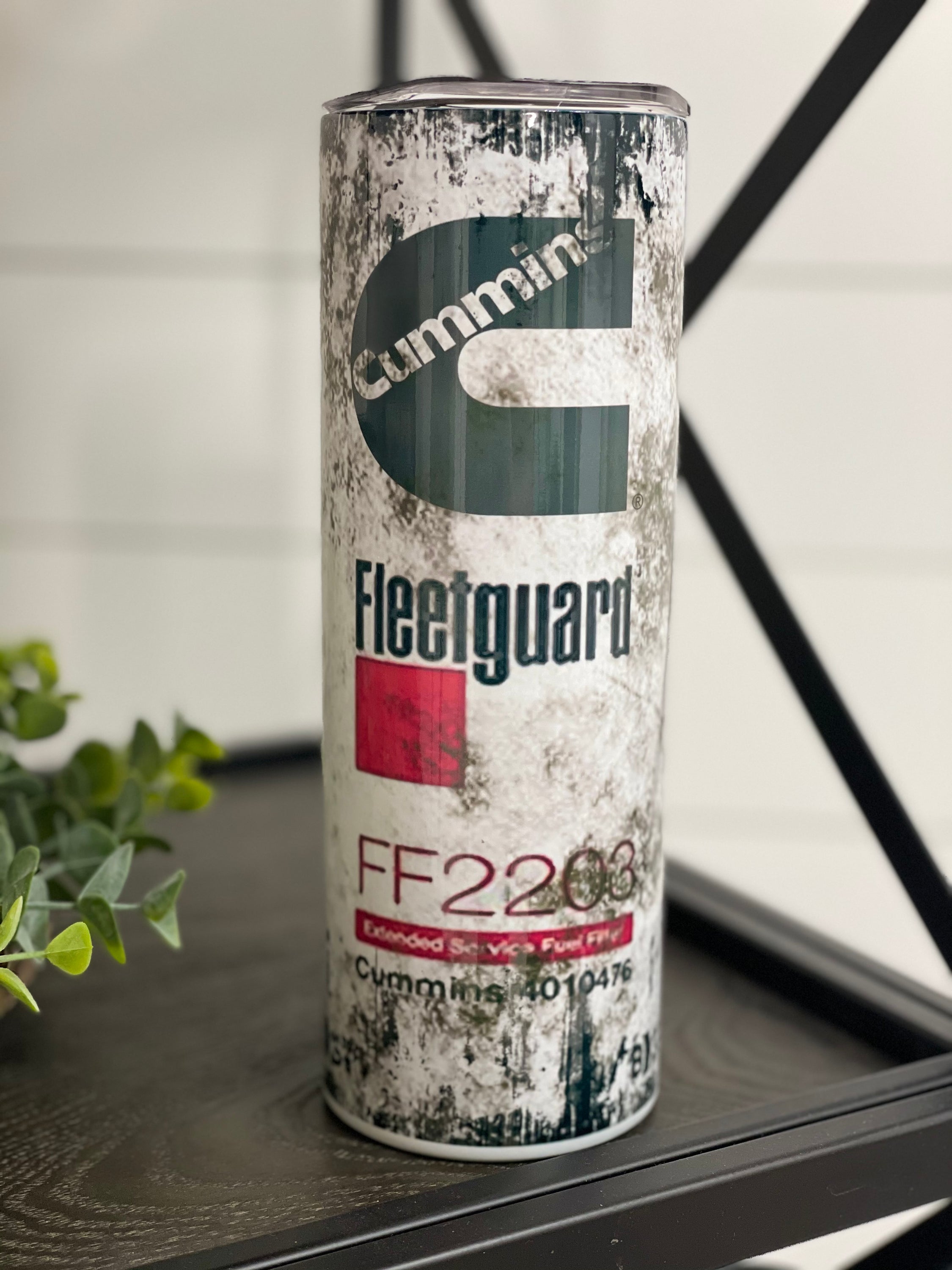 Cummins Fleetguard Filter 20oz Skinny Tumbler with a vibrant full wrap design, featuring a reusable straw.