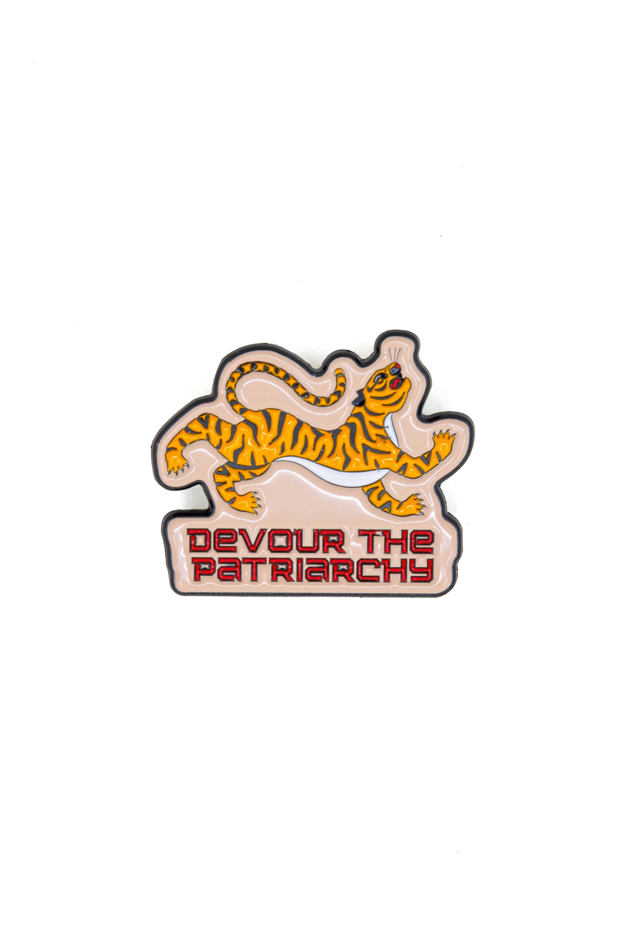 Devour the Patriarchy enamel pin featuring a fierce tiger design and empowering text, perfect for feminist fashion.