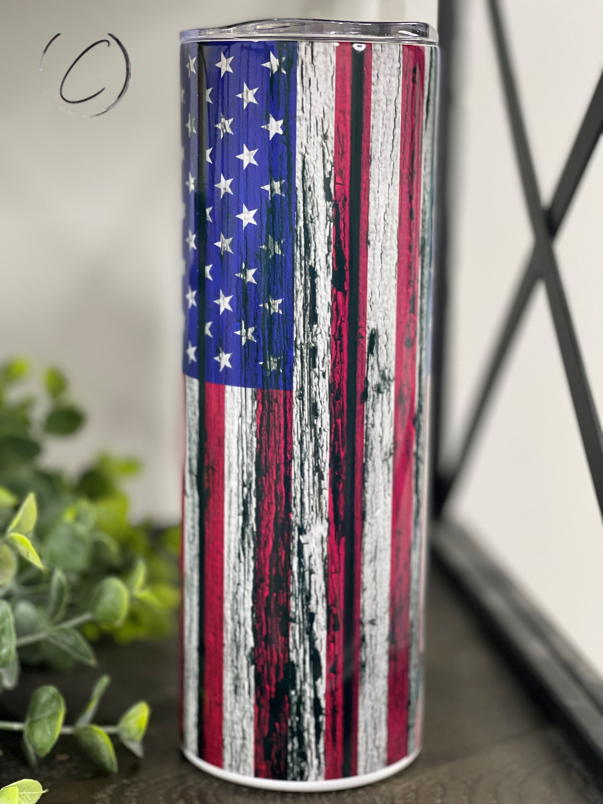 Distressed American Flag 20oz Skinny Tumbler with a vibrant design, featuring a full wrap print and a reusable straw.