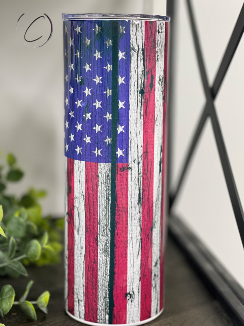 Distressed American Flag 20oz Skinny Tumbler with a vibrant design, featuring a full wrap print and a reusable straw.