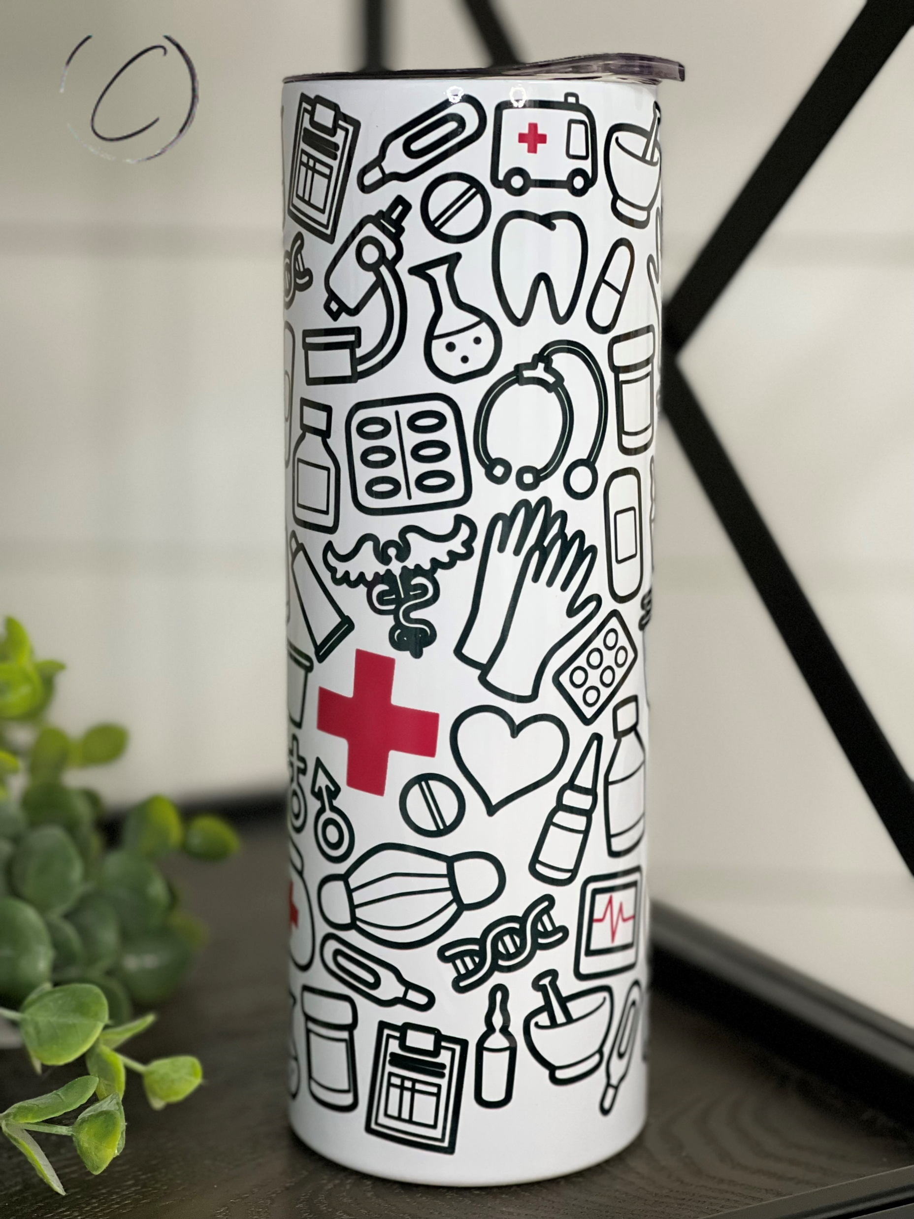 Doodle Doc 20oz Skinny Tumbler with a vibrant full wrap design and reusable straw, perfect for stylish hydration.