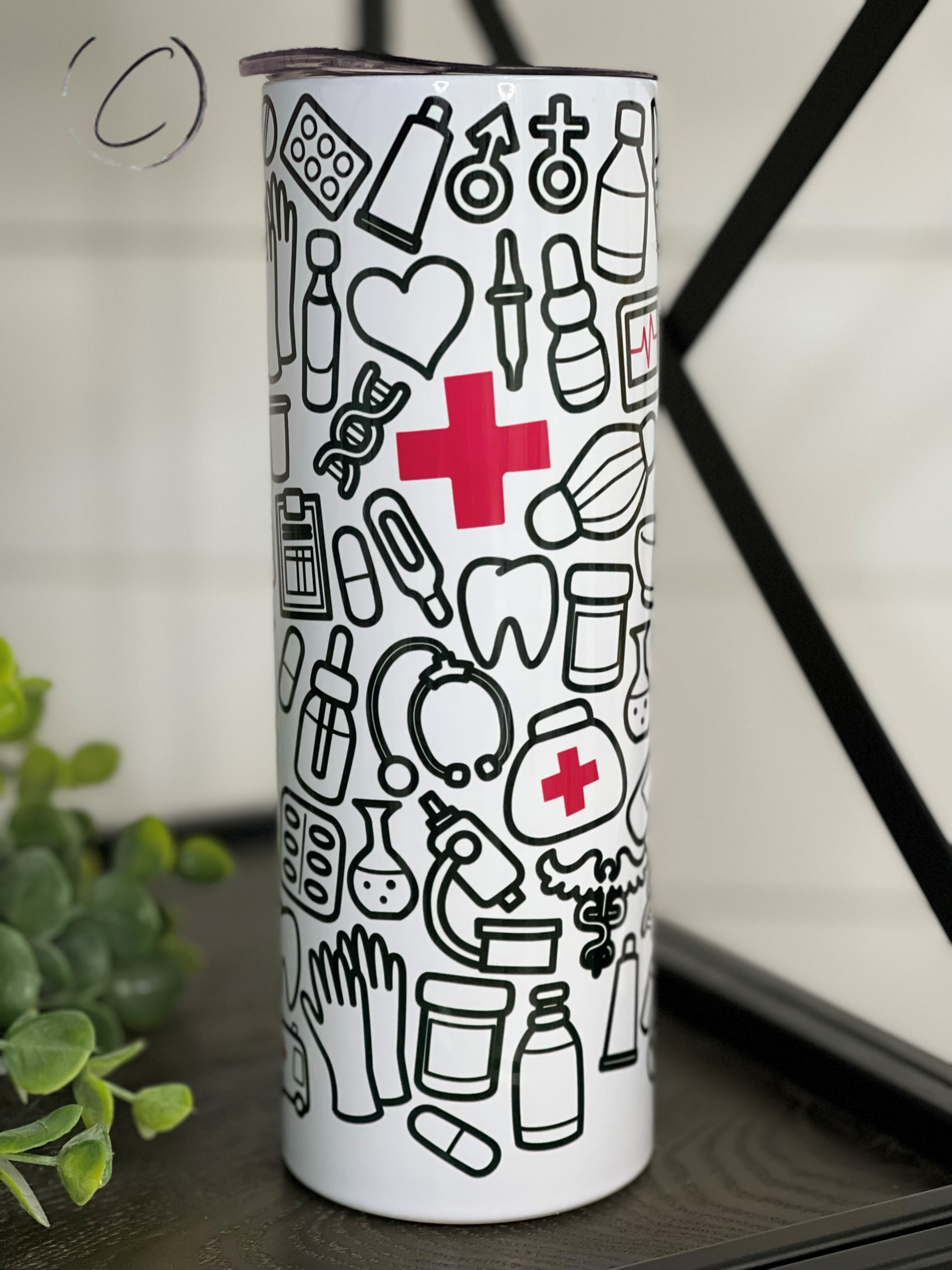 Doodle Doc 20oz Skinny Tumbler with a vibrant full wrap design and reusable straw, perfect for stylish hydration.