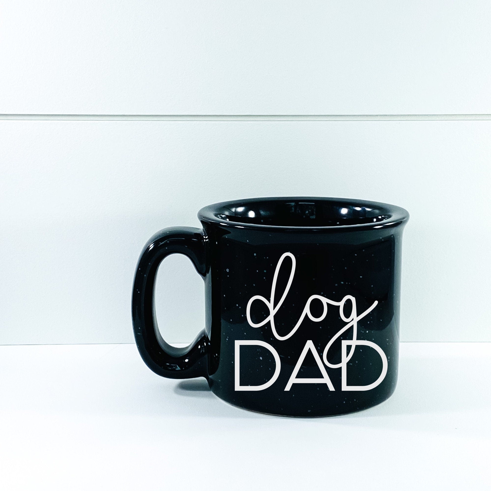 Ceramic Dog Dad Campfire Mug with unique design, perfect for dog lovers.