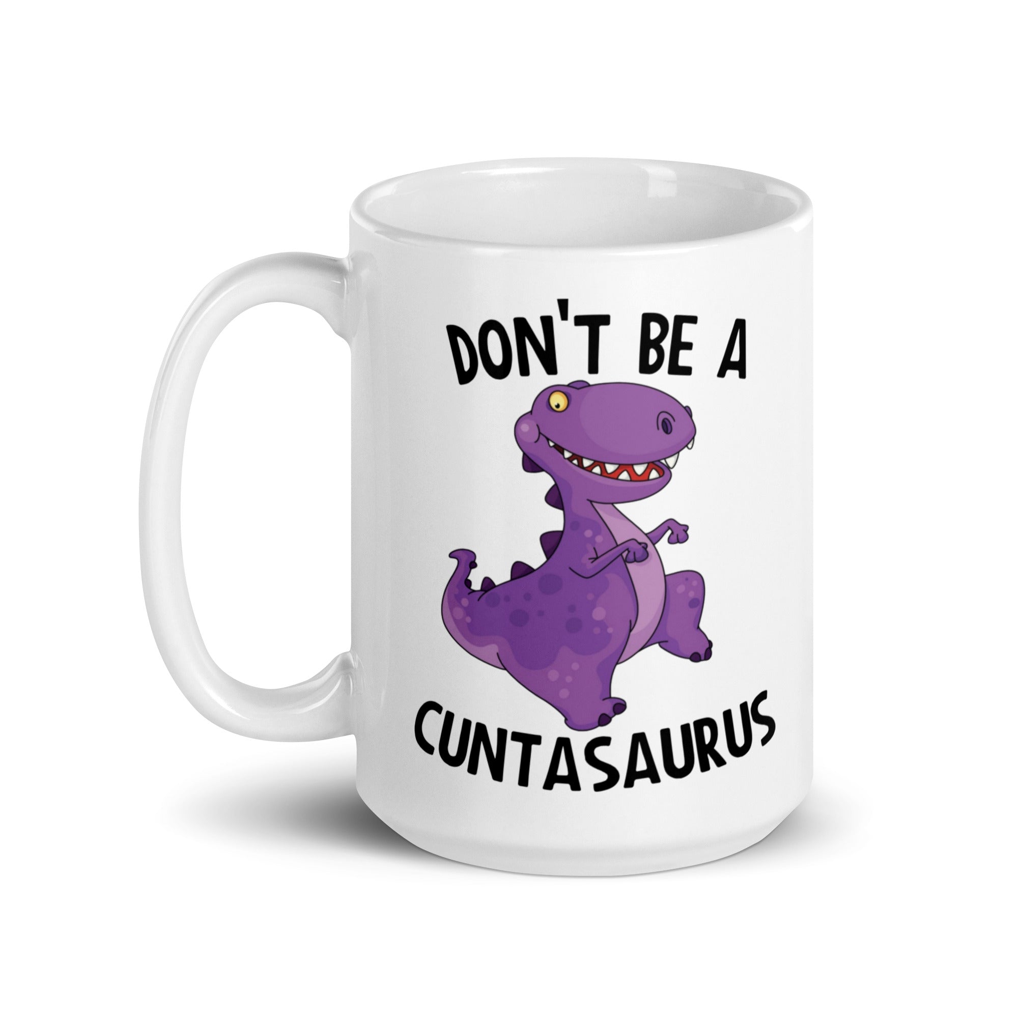 A glossy ceramic mug featuring the humorous phrase 'Don't Be A Cuntasaurus' printed on both sides, available in two sizes.