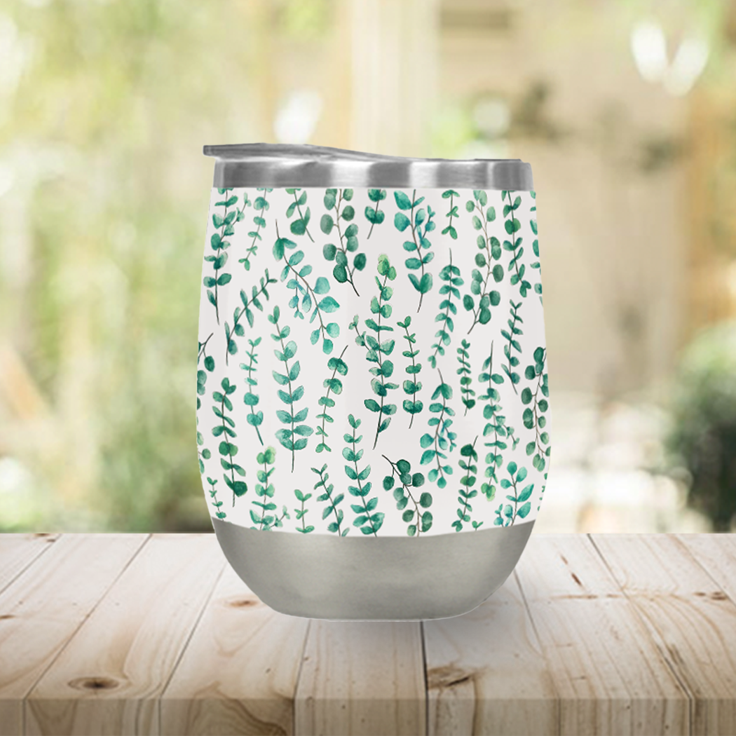 Eucalyptus Watercolor Stemless Wine Tumbler showcasing a beautiful watercolor design, made of stainless steel with a plastic lid.