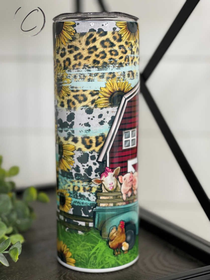 Farm Animal Truck 20oz Skinny Tumbler featuring vibrant farm animal designs, reusable straw, and durable construction.