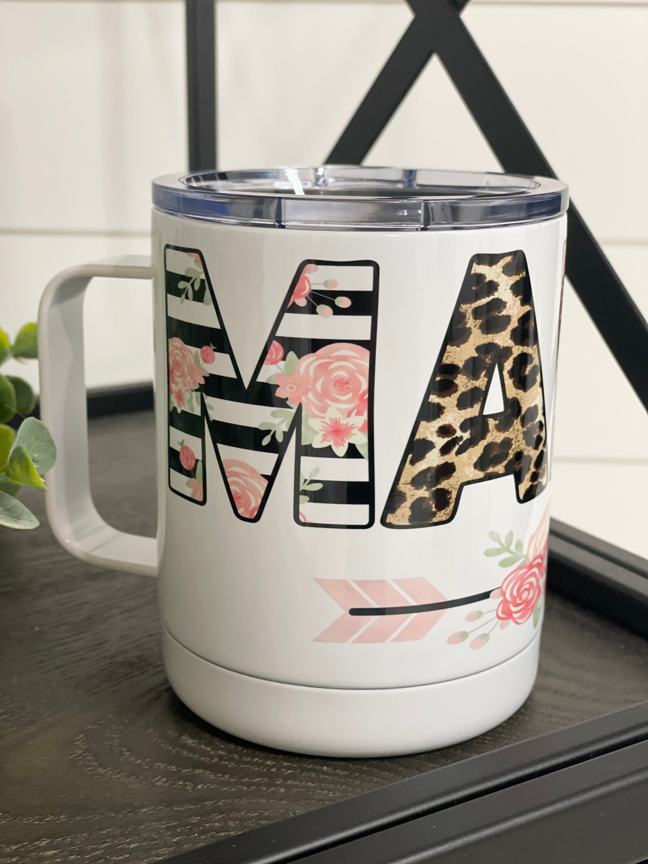 Floral Mama 11oz Travel Mug with a vibrant floral design on both sides, featuring a rubber sealed lid.