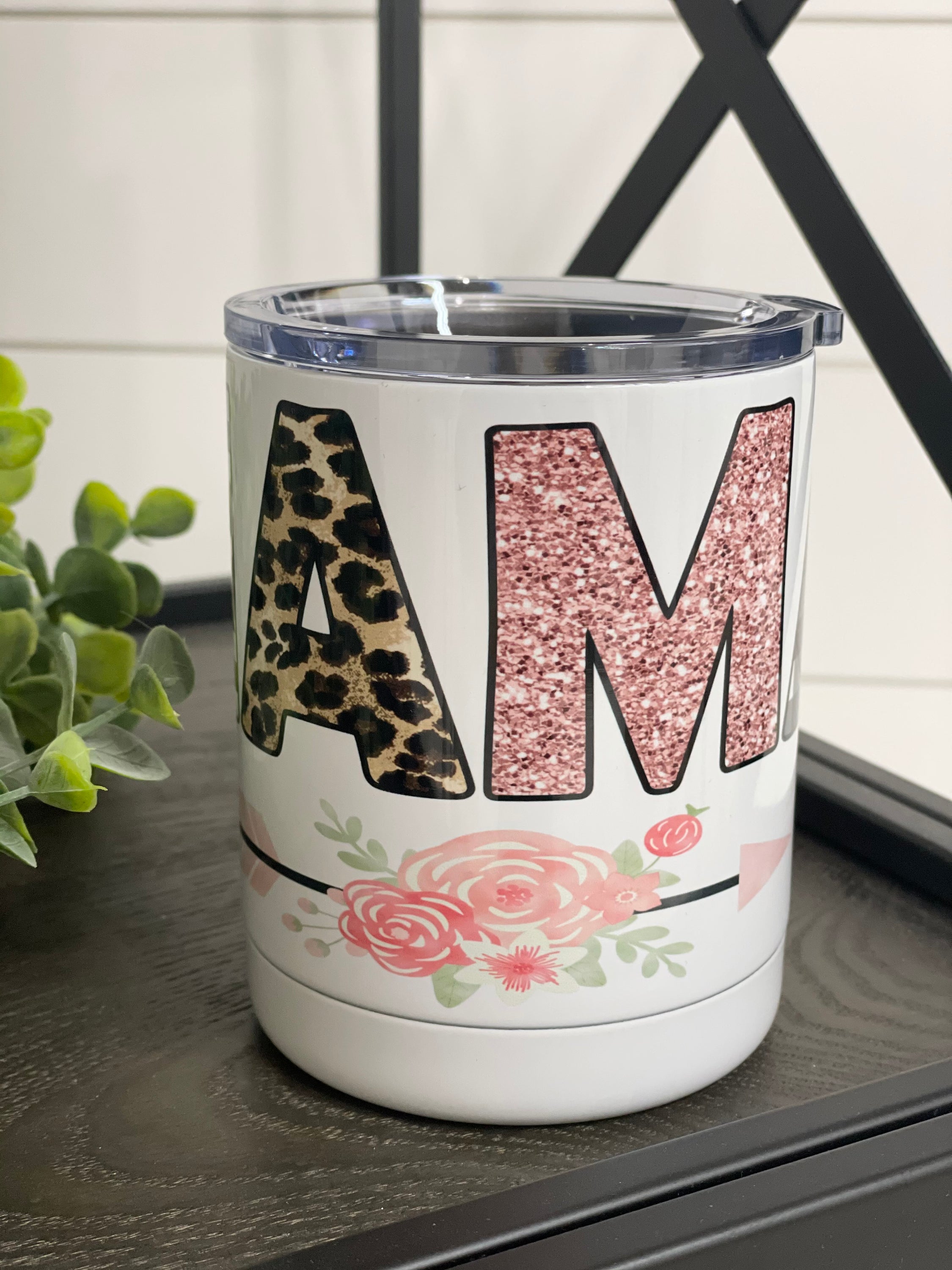 Floral Mama 11oz Travel Mug with a vibrant floral design on both sides, featuring a rubber sealed lid.