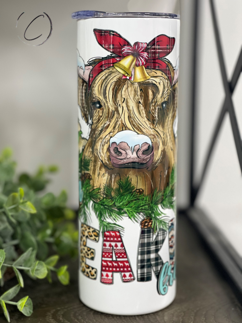 Freaking Freezing Highland Cow 20oz Skinny Tumbler with a unique design, perfect for hot and cold beverages.