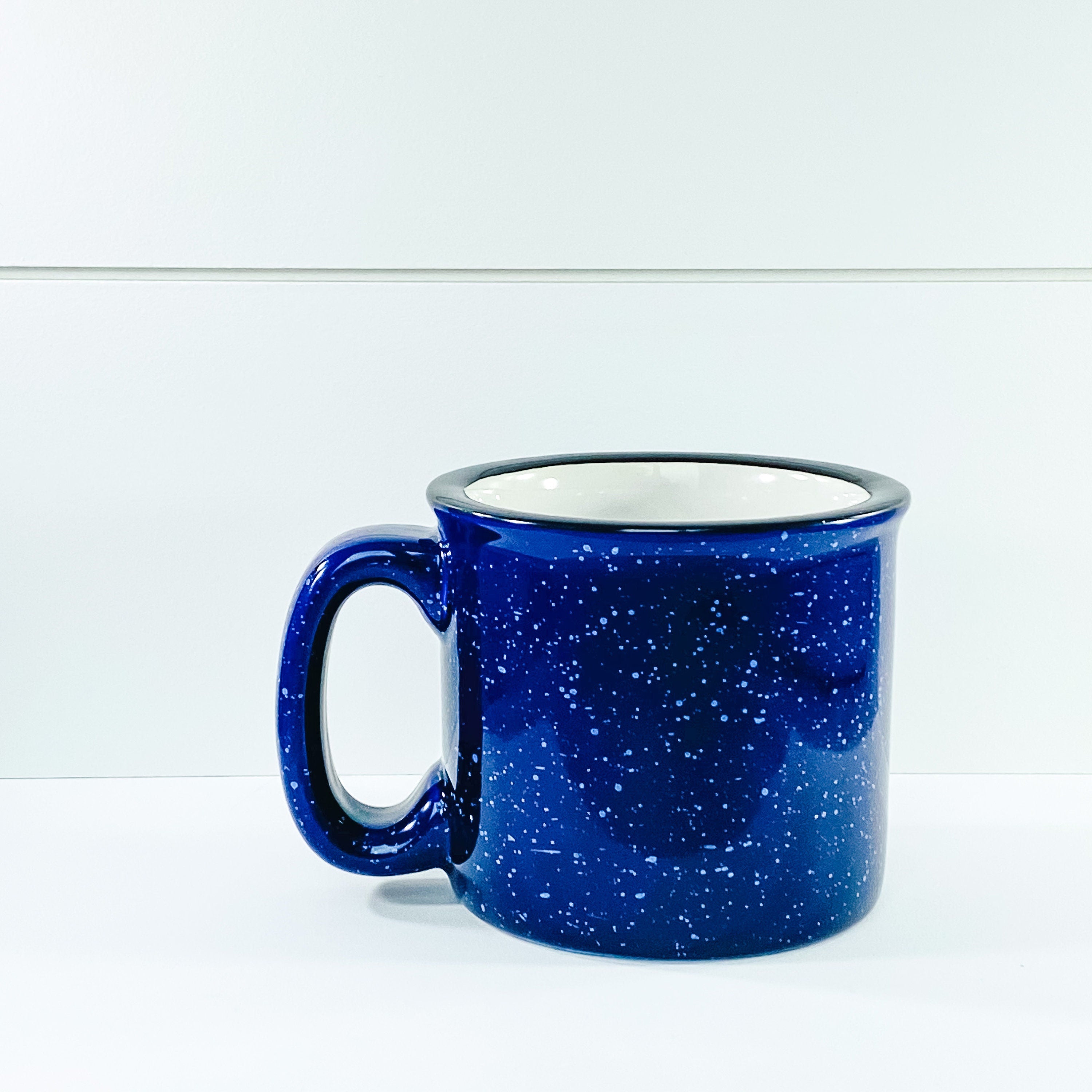 Frosty Mornings and Toasty Mugs Campfire Mug with a vibrant design, showcasing its ceramic material and comfortable handle.