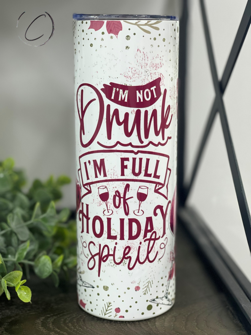 Full Of Holiday Spirit 20oz Skinny Tumbler with festive design and reusable straw.