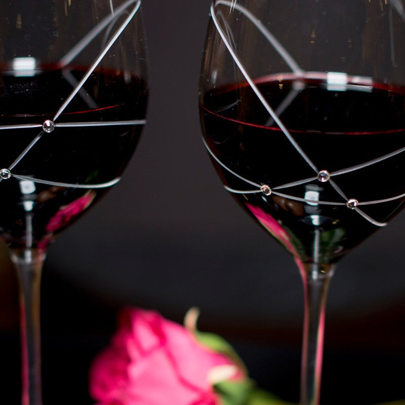 Set of 2 Galaxy Spirals Red Wine Glasses with intricate spiral designs and Swarovski crystal accents in a gift box.