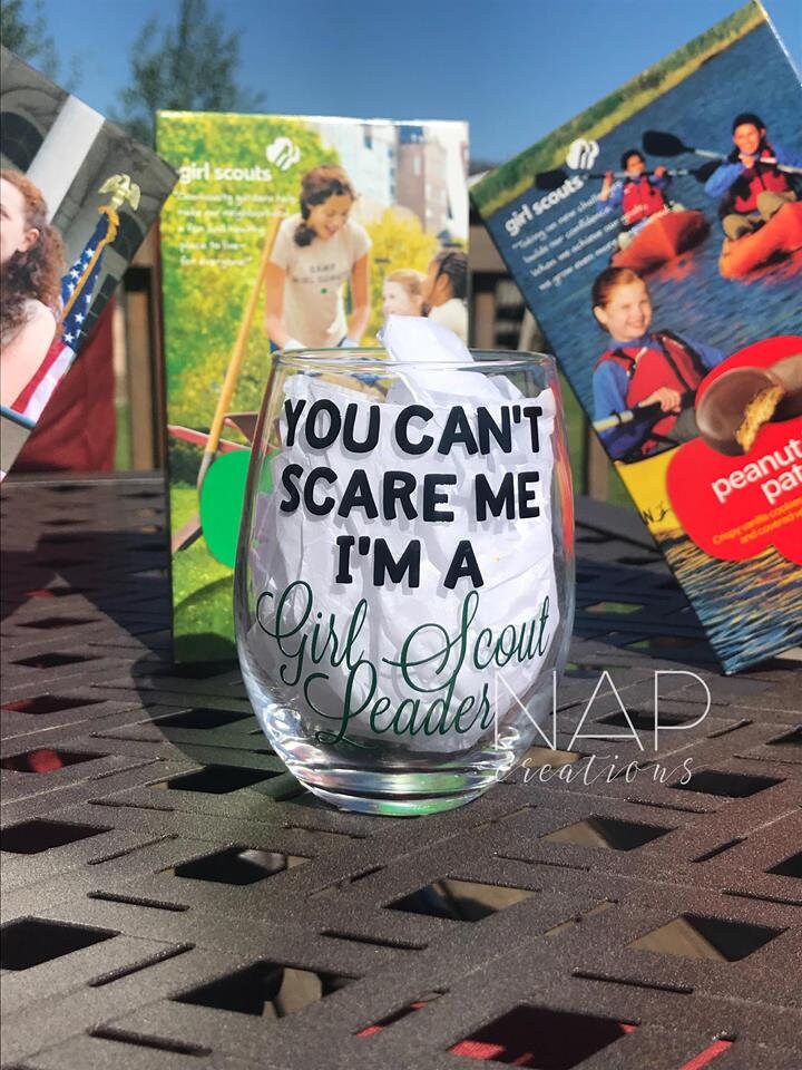 A stylish stemless wine glass designed for Girl Scout leaders, featuring a printed design on one side.