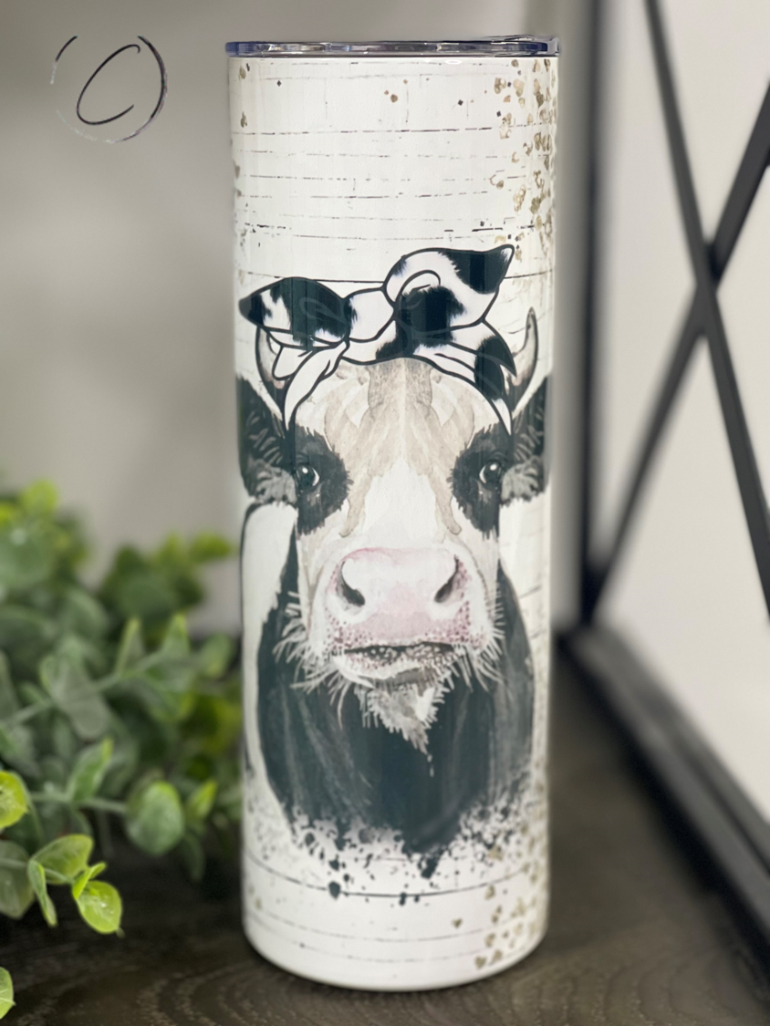 Glitter Heifer 20oz Skinny Tumbler with a vibrant full wrap design, featuring a reusable straw.