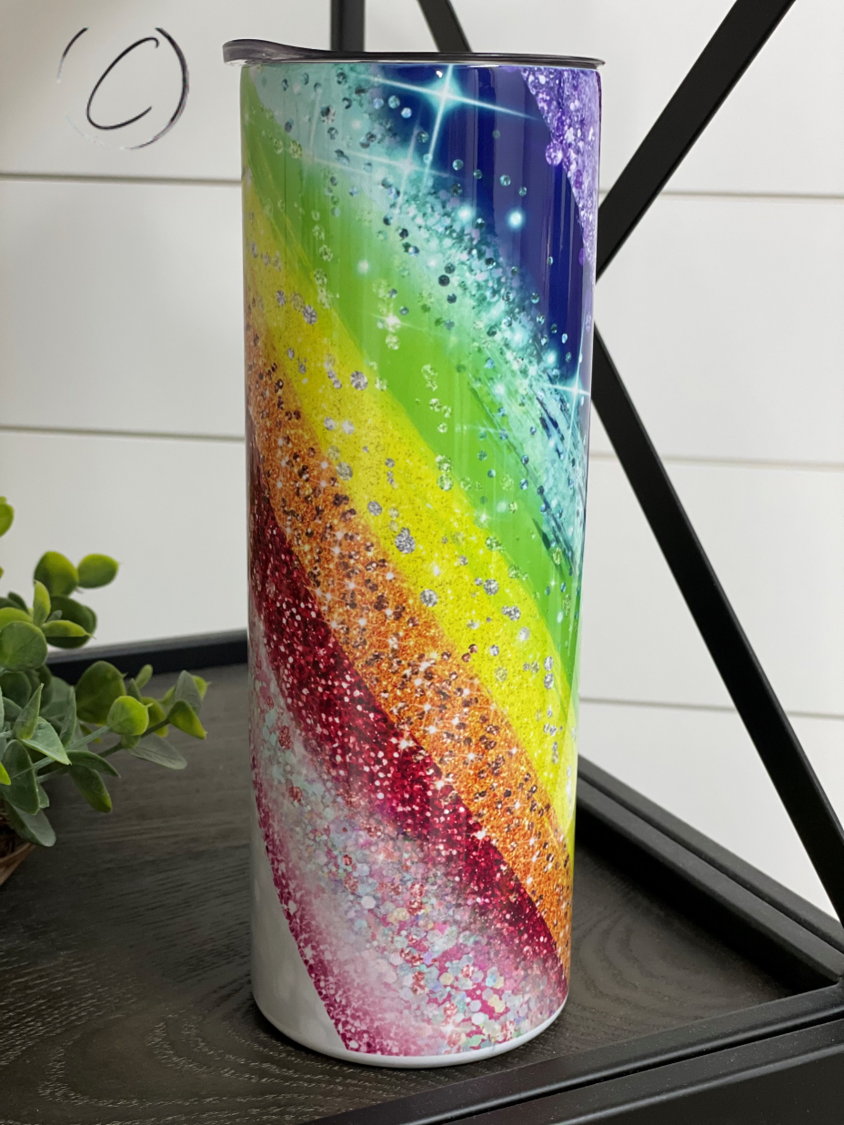 Glitter Rainbow 20oz Skinny Tumbler with vibrant colors and reusable straw, showcasing a full wrap design.