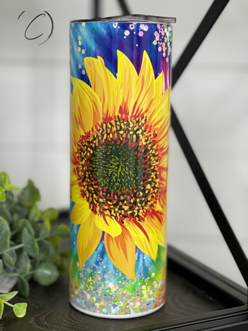 Groovy Sunflower 20oz Skinny Tumbler with vibrant sunflower design and reusable straw.