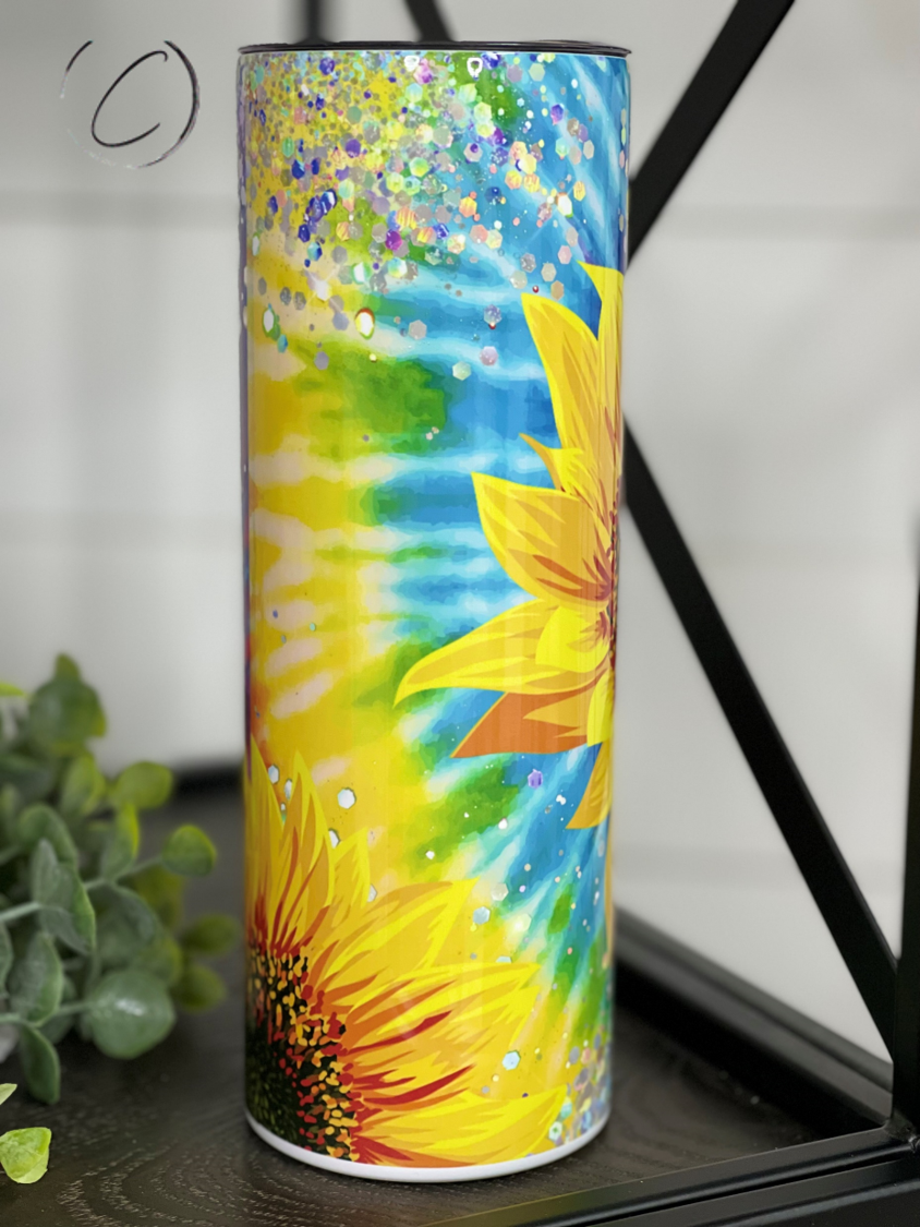 Groovy Sunflower 20oz Skinny Tumbler with vibrant sunflower design and reusable straw.