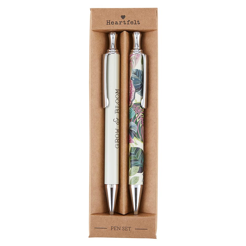 Grow & Bloom Pen Set of 2 featuring a white pen with 'Grow and Bloom' text and a colorful foliage print pen in teal, pink, and green, elegantly boxed.