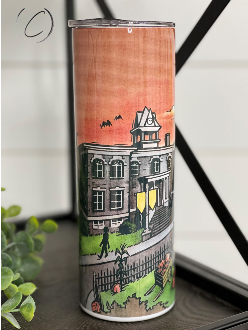 Halloweentown 20oz Skinny Tumbler featuring a vibrant Halloween-themed design, complete with a reusable straw.