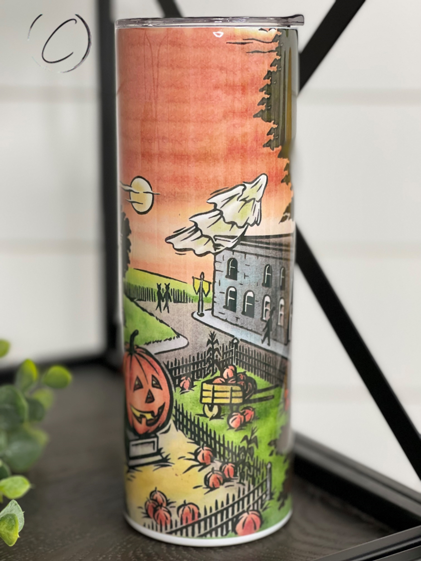 Halloweentown 20oz Skinny Tumbler featuring a vibrant Halloween-themed design, complete with a reusable straw.