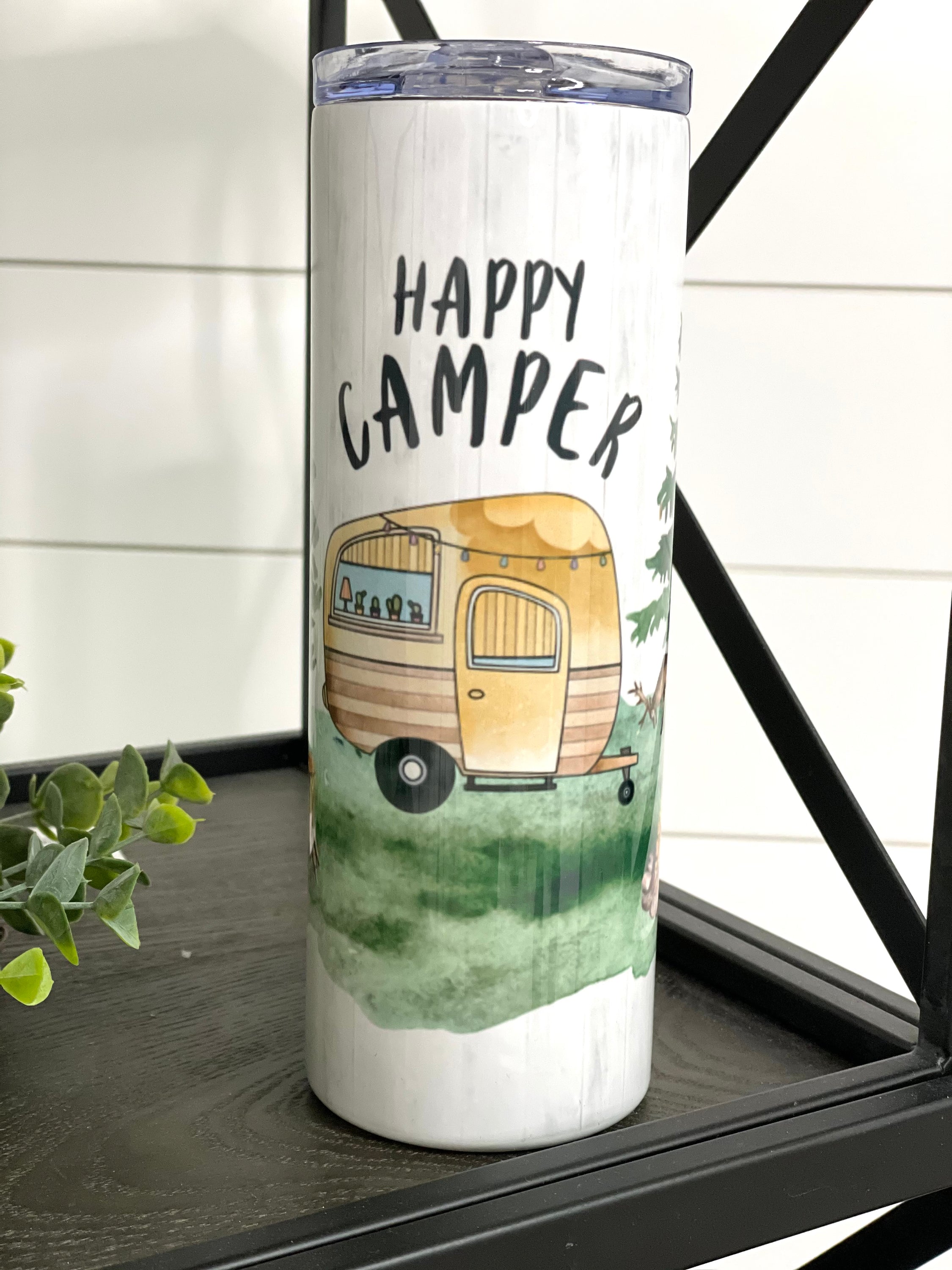 Happy Camper 20oz Skinny Tumbler with a vibrant design, perfect for outdoor adventures and everyday use.