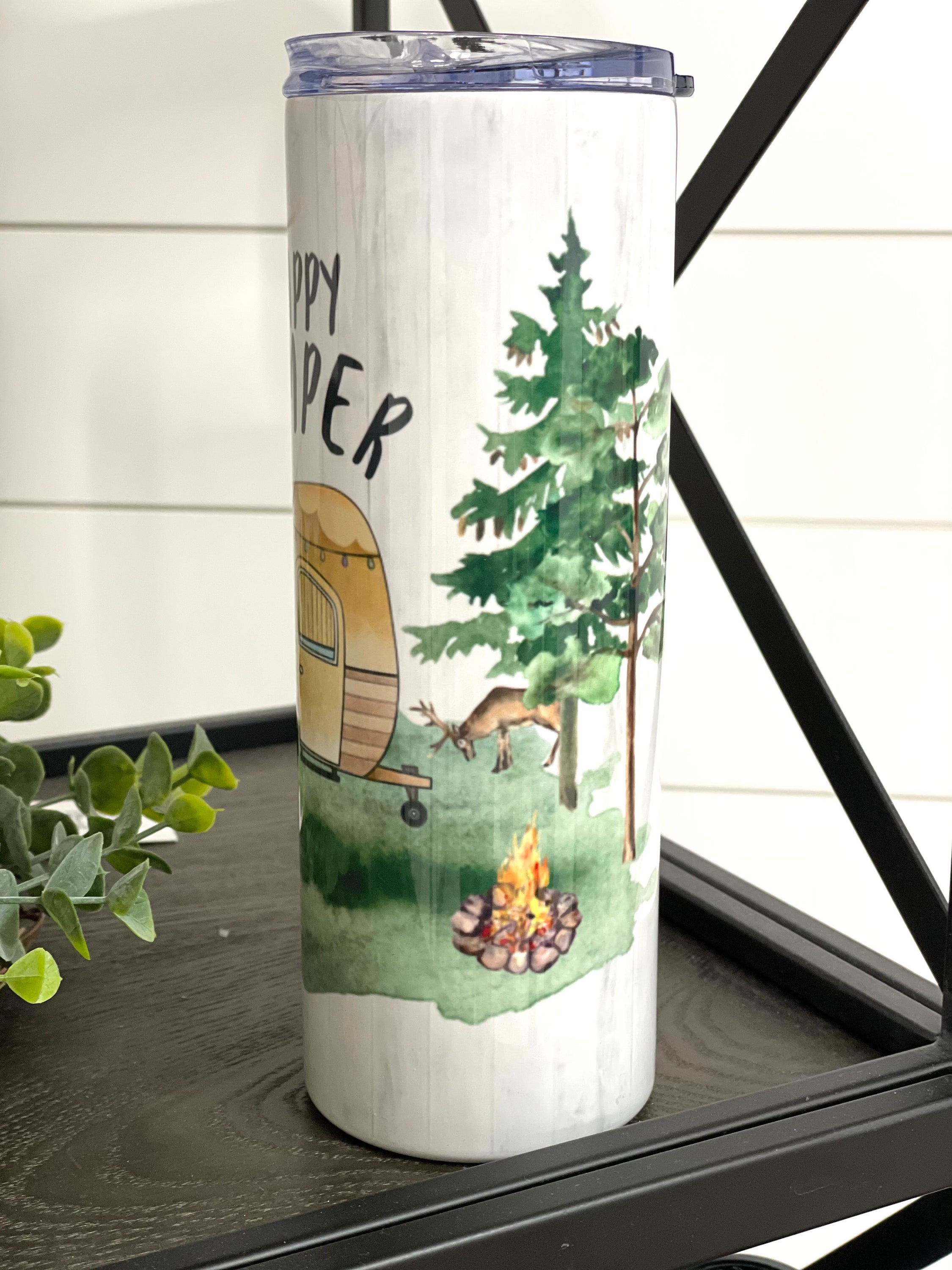 Happy Camper 20oz Skinny Tumbler with a vibrant design, perfect for outdoor adventures and everyday use.