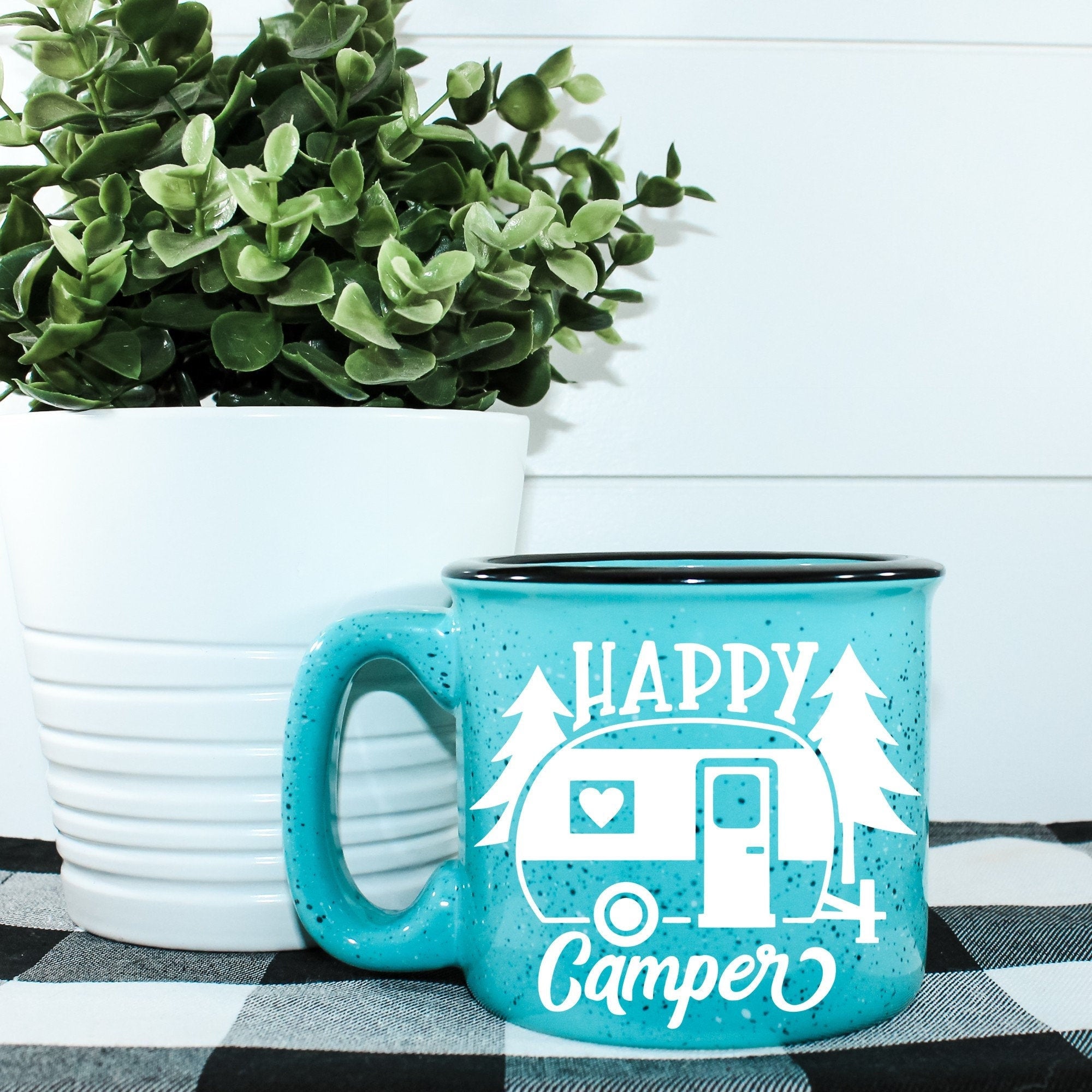 Happy Camper Campfire Mug with outdoor design, ceramic material, and 15 oz capacity, perfect for camping and outdoor activities.