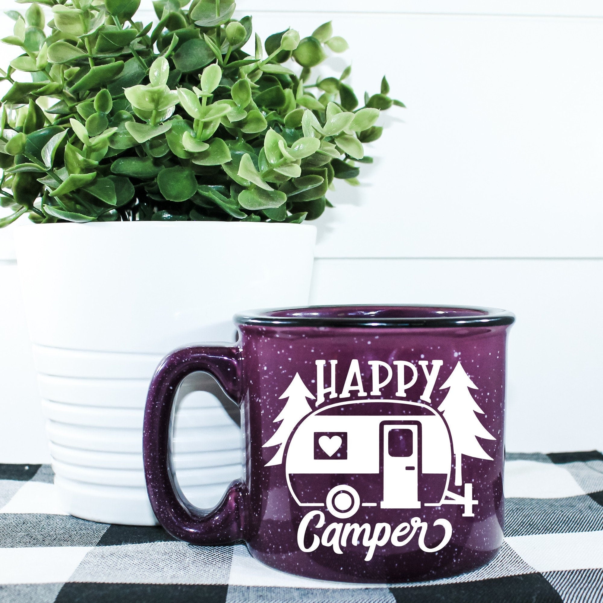 Happy Camper Campfire Mug with outdoor design, ceramic material, and 15 oz capacity, perfect for camping and outdoor activities.