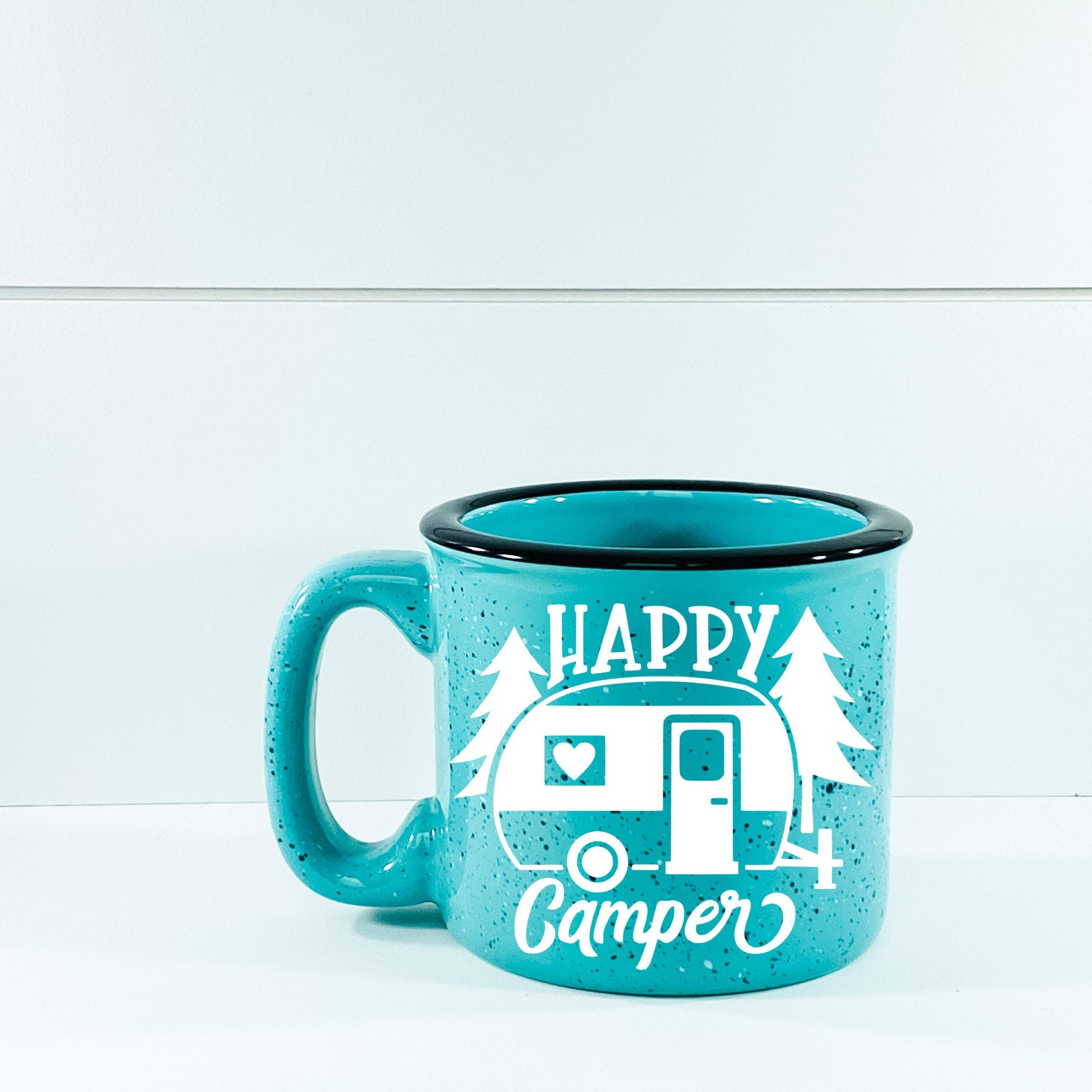 Happy Camper Campfire Mug with outdoor design, ceramic material, and 15 oz capacity, perfect for camping and outdoor activities.