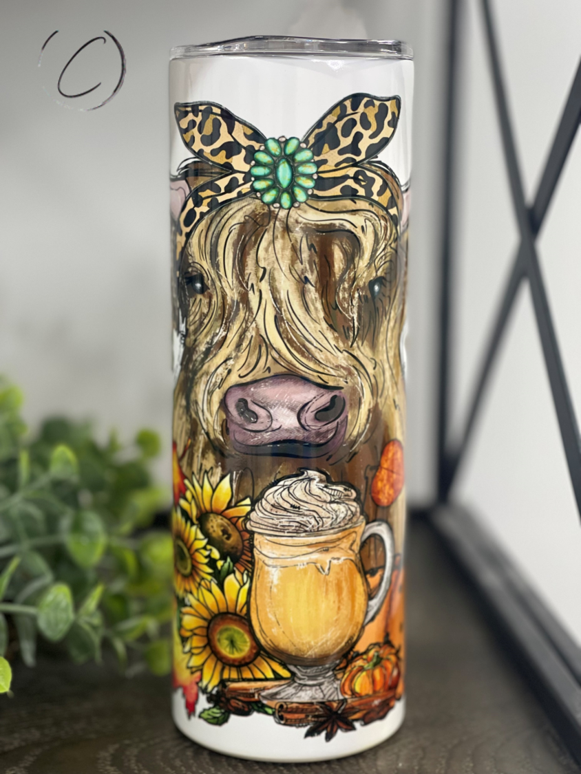 Harvest Highland Cow 20oz Skinny Tumbler featuring a vibrant Highland Cow design, perfect for hot and cold beverages.