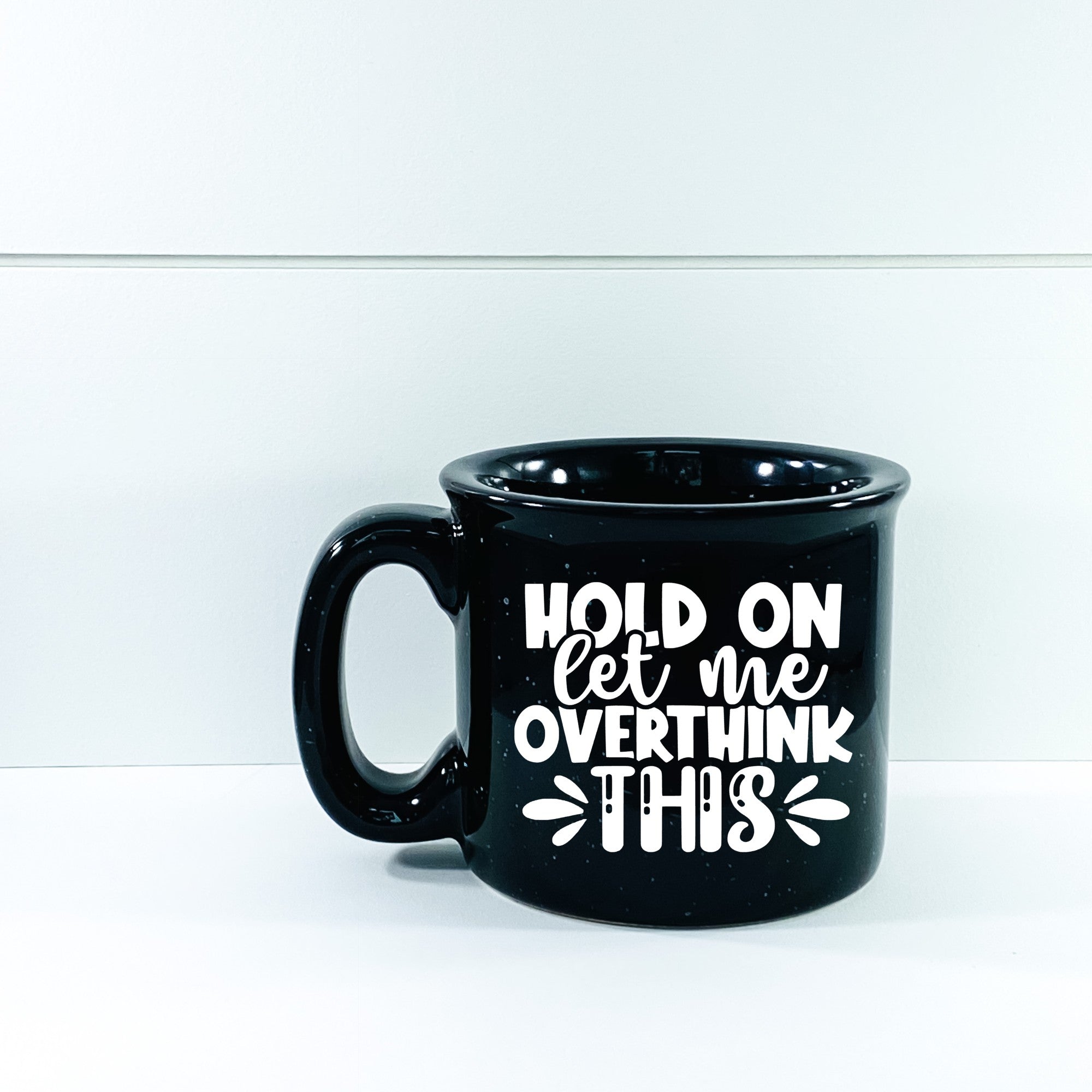 Ceramic campfire mug with 'Hold On Let Me Overthink This' design, perfect for cozy beverages.