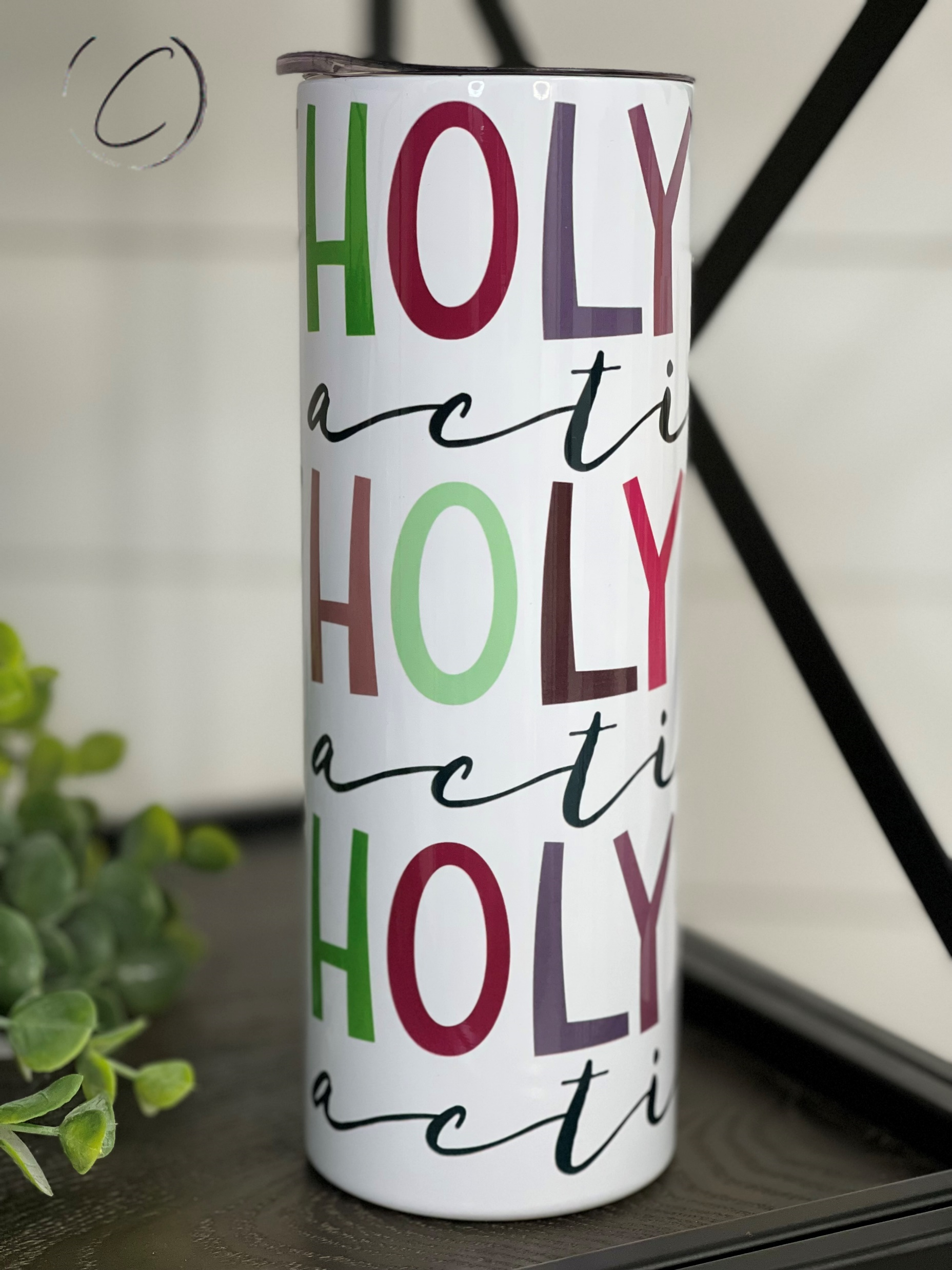 Holy Spirit Activate 20oz Skinny Tumbler with vibrant design and reusable straw, showcasing durability and style.