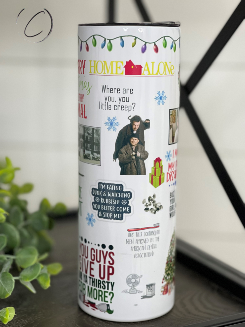 Home Alone 20oz Skinny Tumbler featuring a unique design, reusable straw, and durable construction.