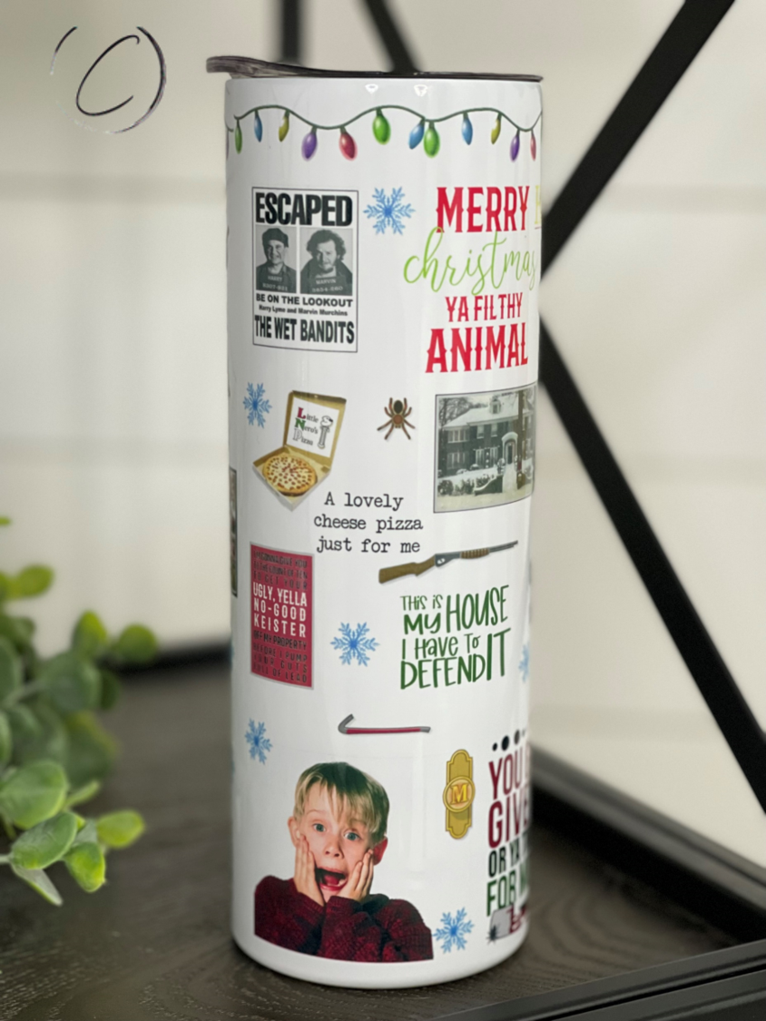 Home Alone 20oz Skinny Tumbler featuring a unique design, reusable straw, and durable construction.