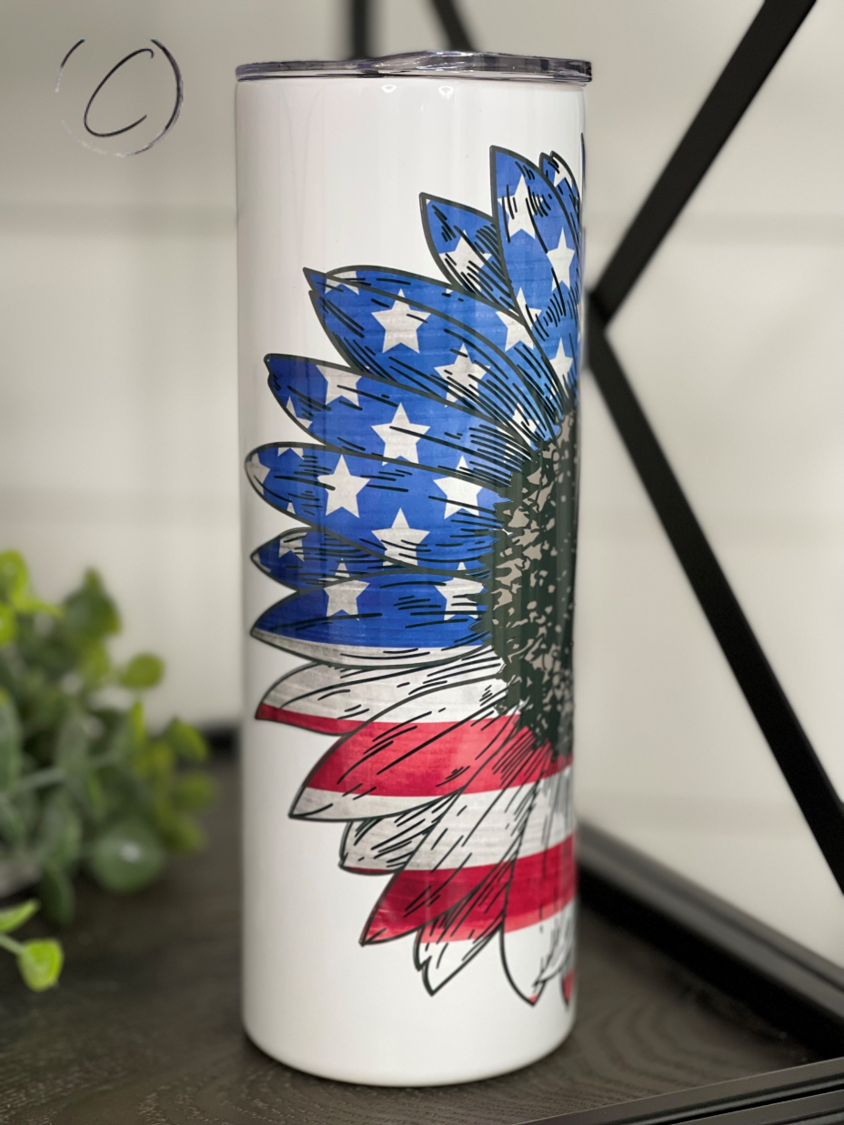 Home Of The Free Sunflower 20oz Skinny Tumbler featuring a vibrant sunflower design, perfect for stylish hydration.