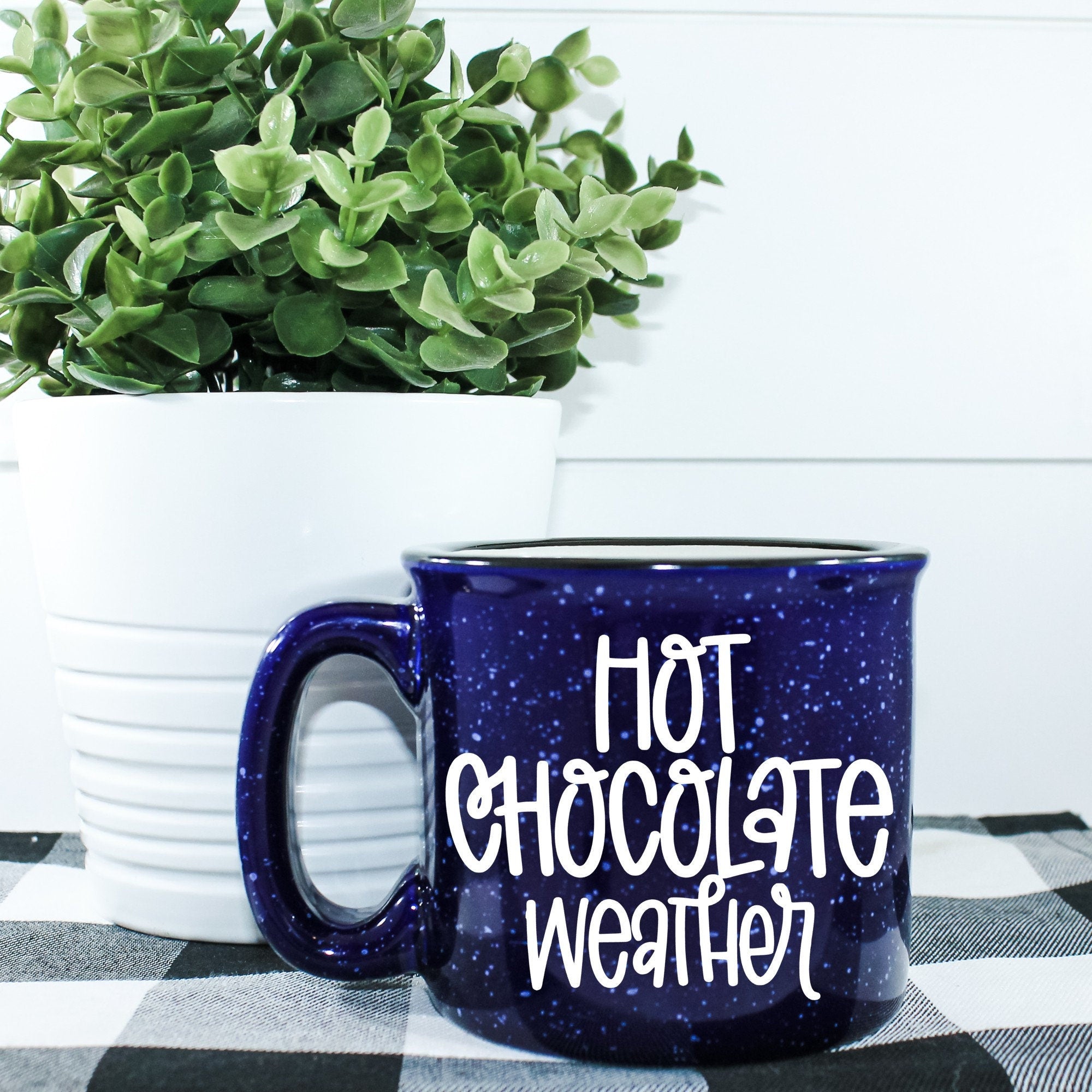 A cozy ceramic campfire mug designed for hot chocolate, featuring a vibrant vinyl design, perfect for chilly weather.