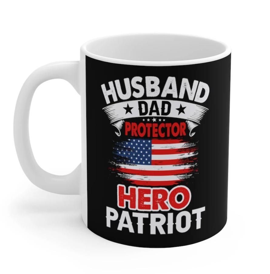 White ceramic mug with the text 'Husband, Dad, Protector, Hero, Patriot' printed on it, ideal for coffee or tea.