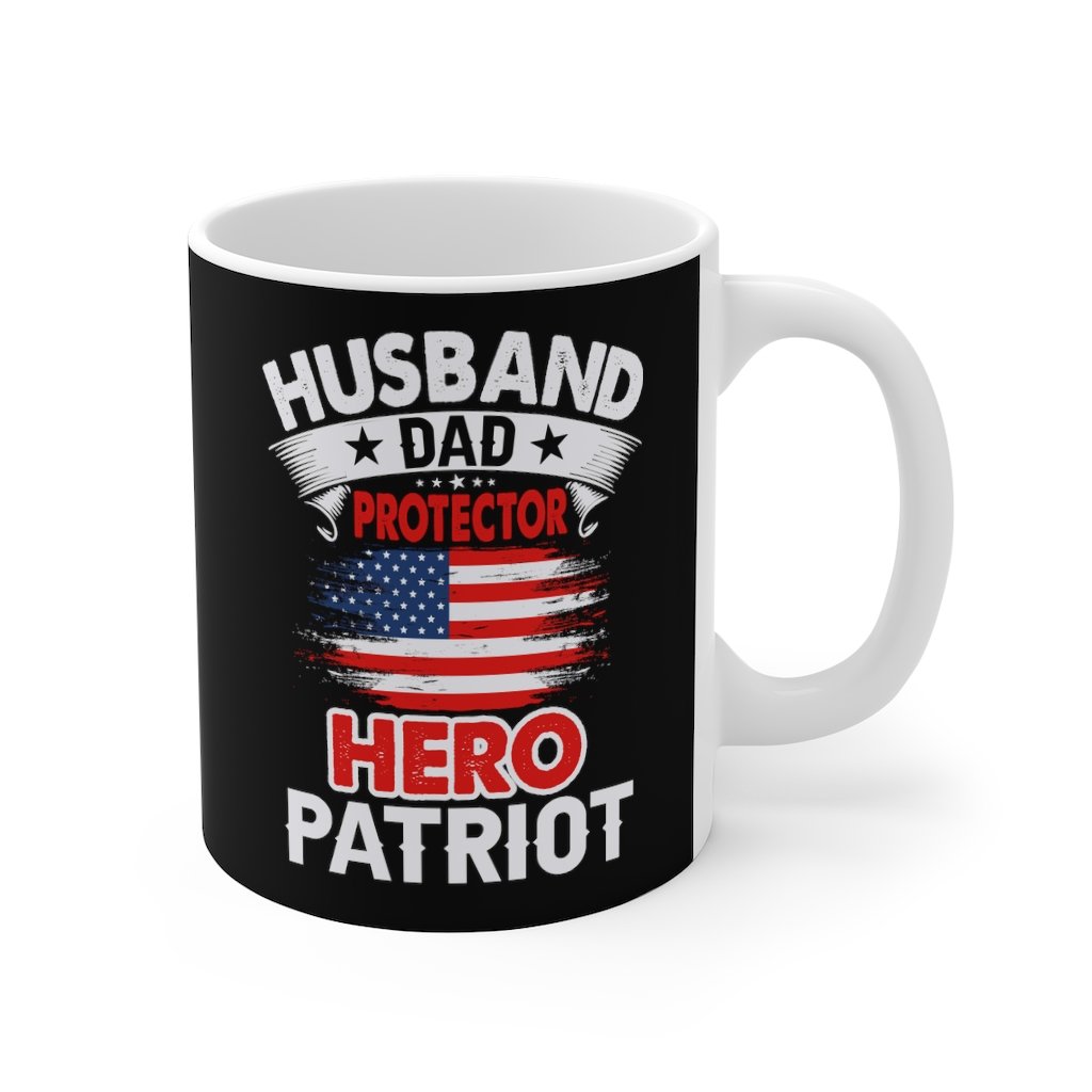 White ceramic mug with the text 'Husband, Dad, Protector, Hero, Patriot' printed on it, ideal for coffee or tea.