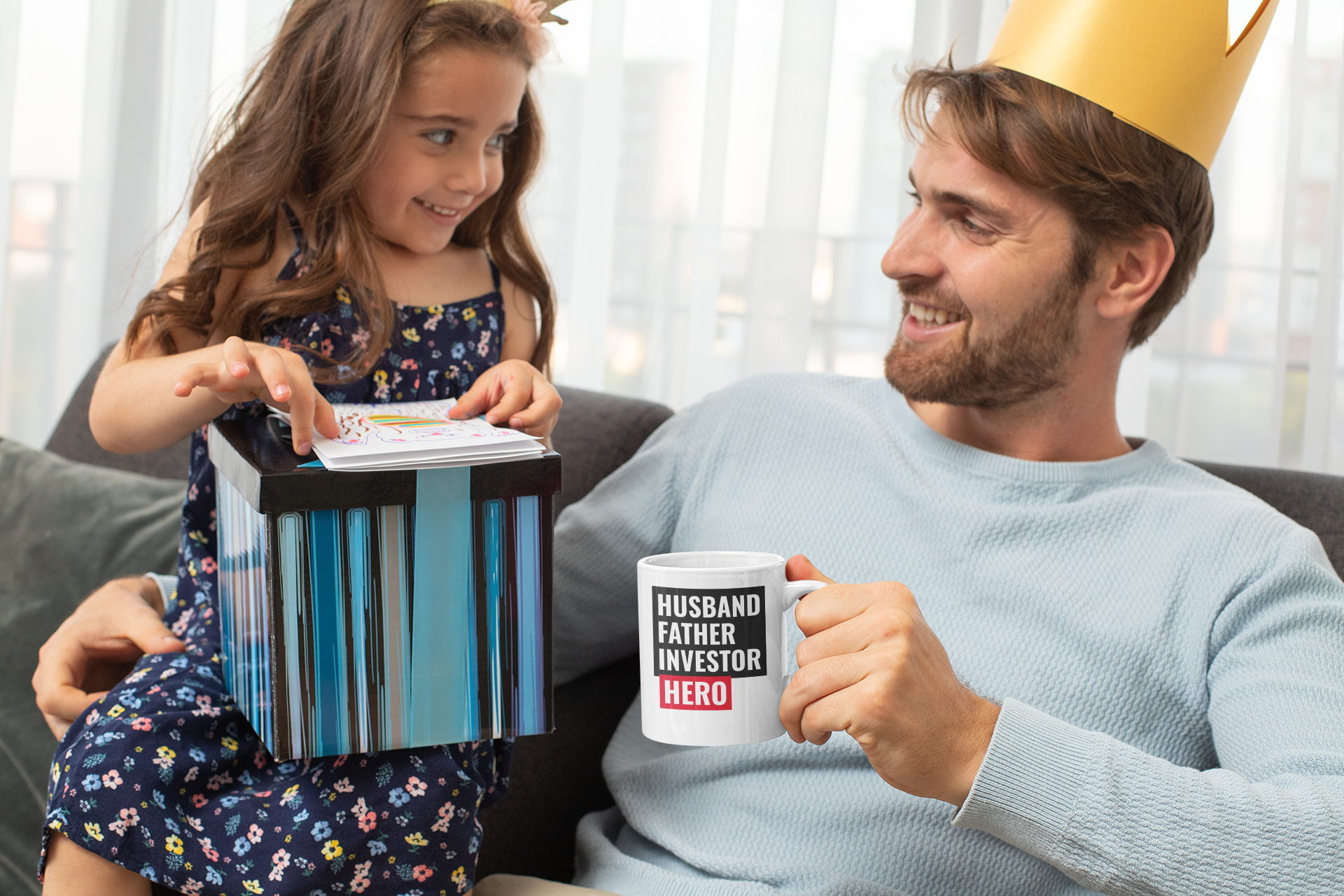 A white ceramic mug featuring the text 'Husband, Father, Investor, Hero' with a classic rounded design and C-handle.